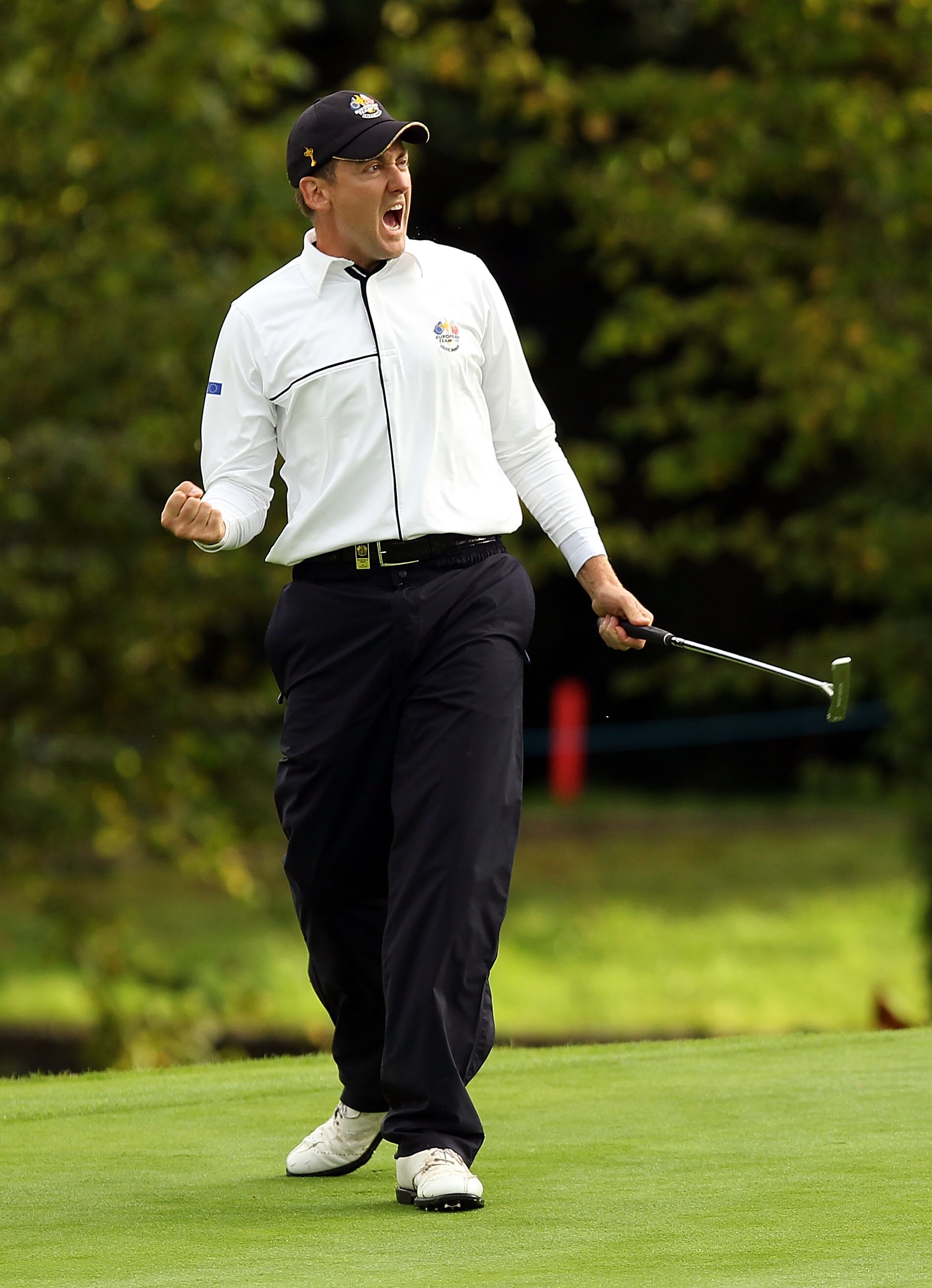 NEWPORT, WALES - OCTOBER 03:  Ian Poulter of Europe celebrates holing a putt on the 15th green  during the  Fourball & Foursome Matches during the 2010 Ryder Cup at the Celtic Manor Resort on October 3, 2010 in Newport, Wales.  (Photo by Ross Kinnaird/Get
