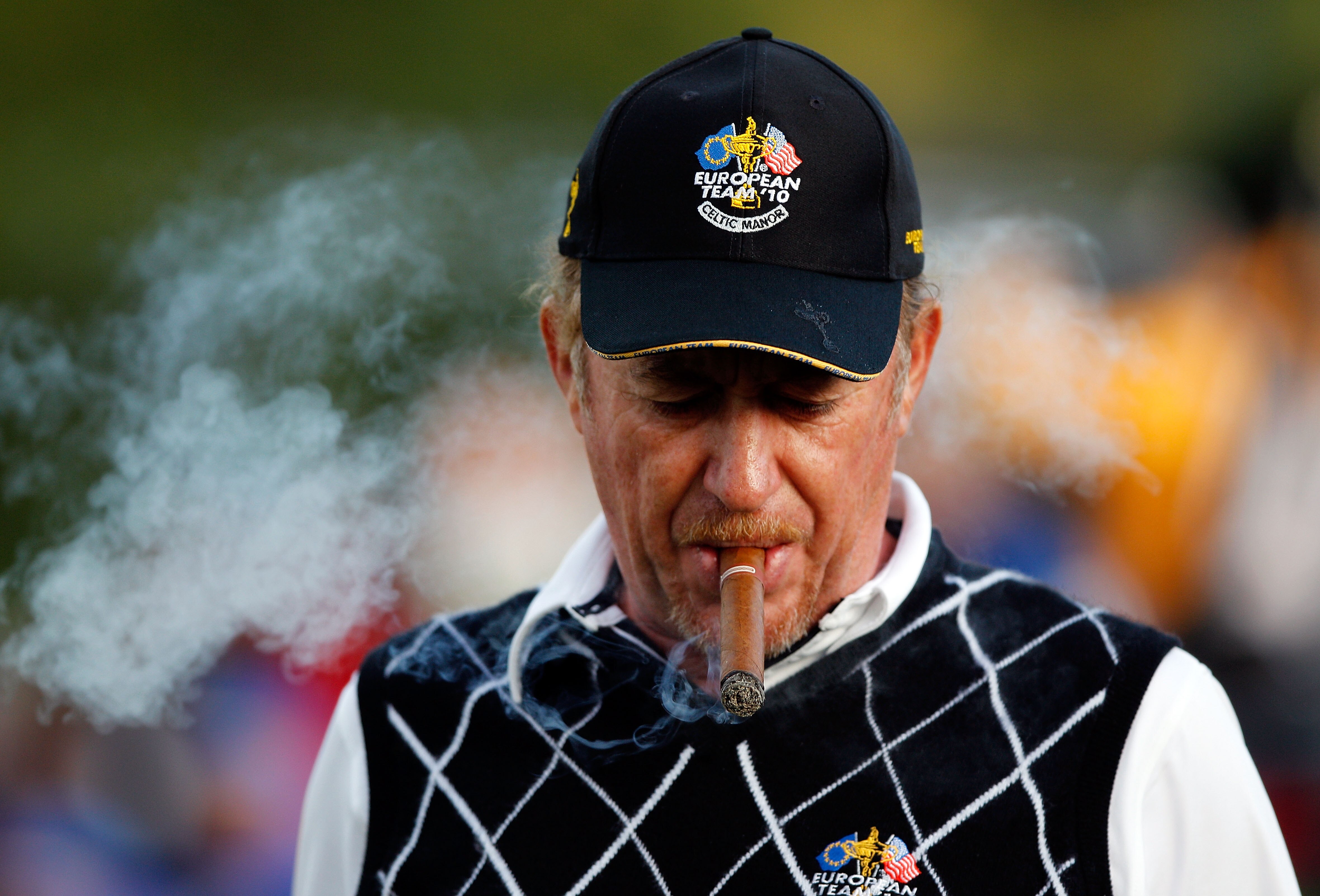 NEWPORT, WALES - OCTOBER 03:  Miguel Angel Jimenez of Europe smokes a cigar during the  Fourball & Foursome Matches during the 2010 Ryder Cup at the Celtic Manor Resort on October 3, 2010 in Newport, Wales.  (Photo by Sam Greenwood/Getty Images)