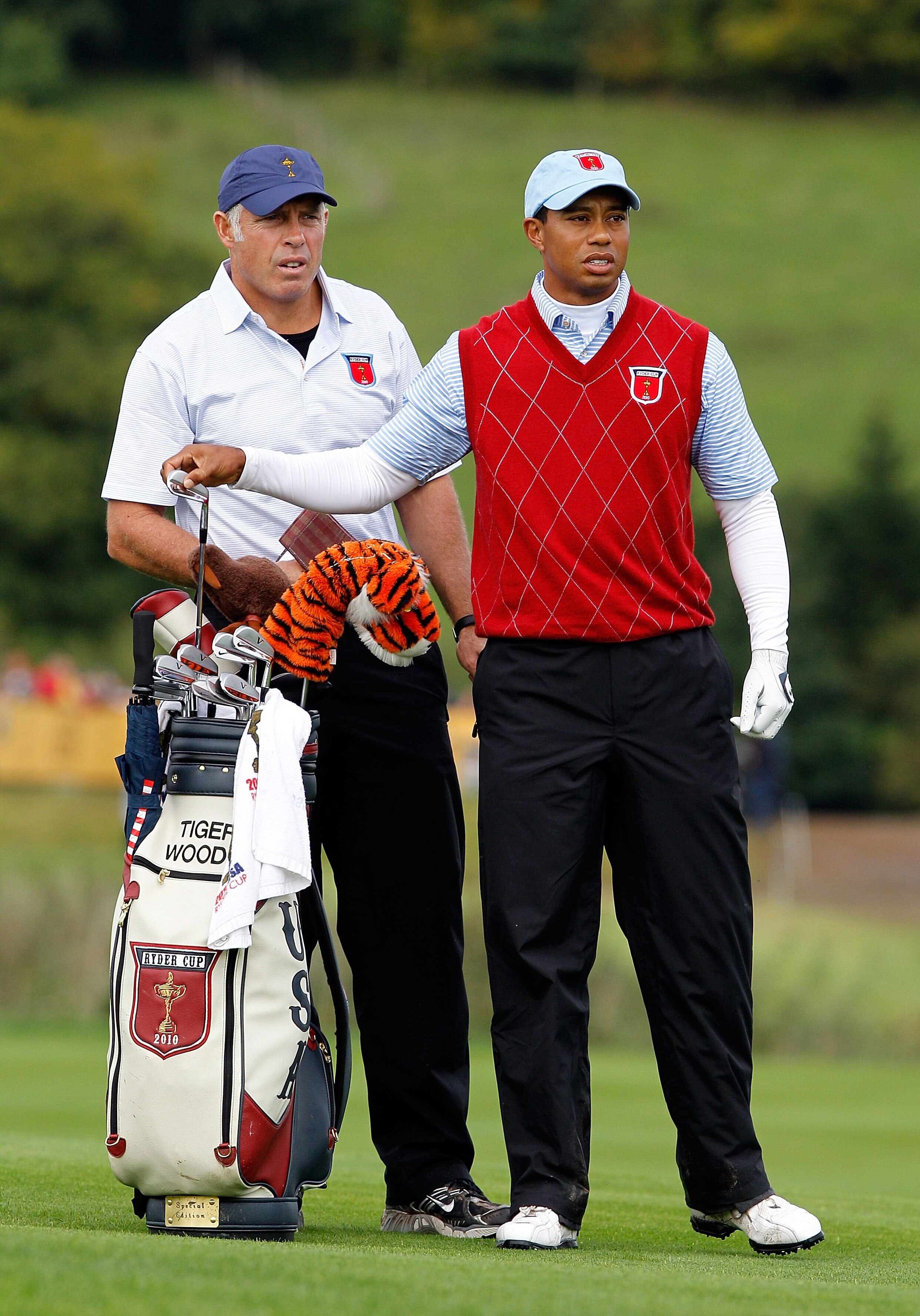 NEWPORT, WALES - OCTOBER 03:  Tiger Woods of the USA lines up a shot with caddie Steve Williams during the  Fourball & Foursome Matches during the 2010 Ryder Cup at the Celtic Manor Resort on October 3, 2010 in Newport, Wales.  (Photo by Sam Greenwood/Get