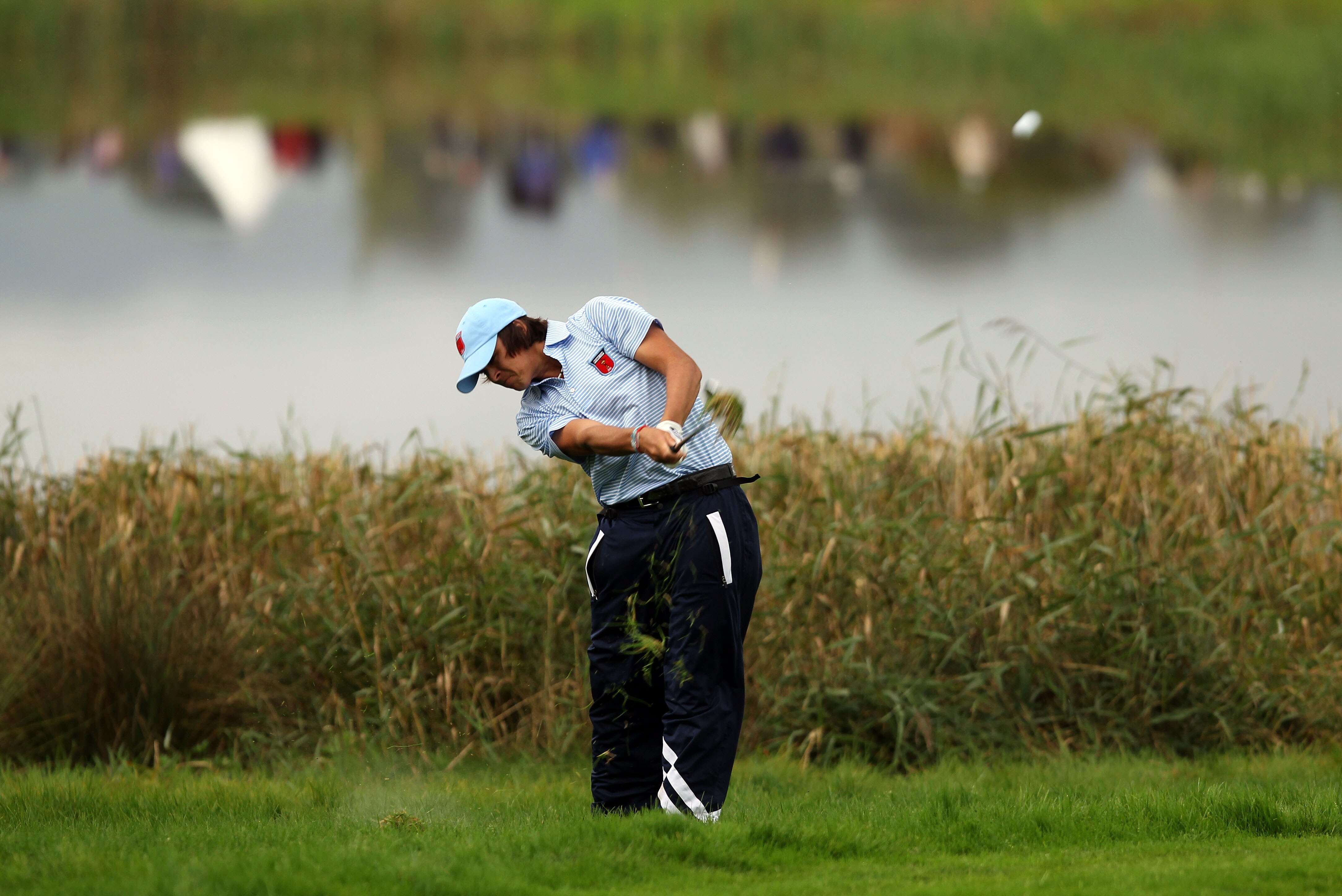 NEWPORT, WALES - OCTOBER 03:  Rickie Fowler of the USA hits from the rough during the Fourball & Foursome Matches during the 2010 Ryder Cup at the Celtic Manor Resort on October 3, 2010 in Newport, Wales.  (Photo by Ross Kinnaird/Getty Images)