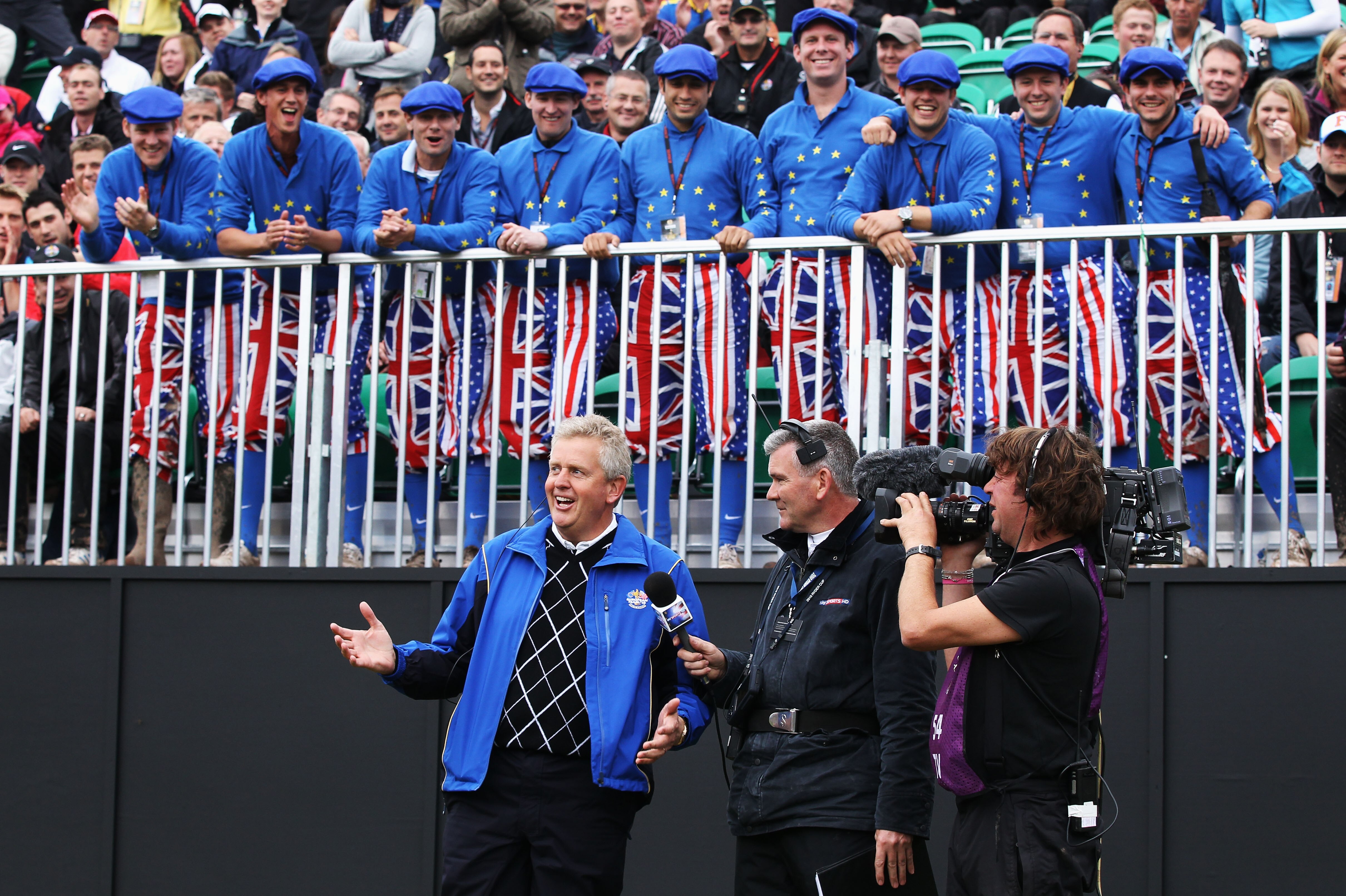 NEWPORT, WALES - OCTOBER 02:  Europe Team Captain Colin Montgomerie is interviewed by Tim Barter of Sky TV in front of a group of Ryder Cup fans on the first tee during the  Fourball & Foursome Matches during the 2010 Ryder Cup at the Celtic Manor Resort 