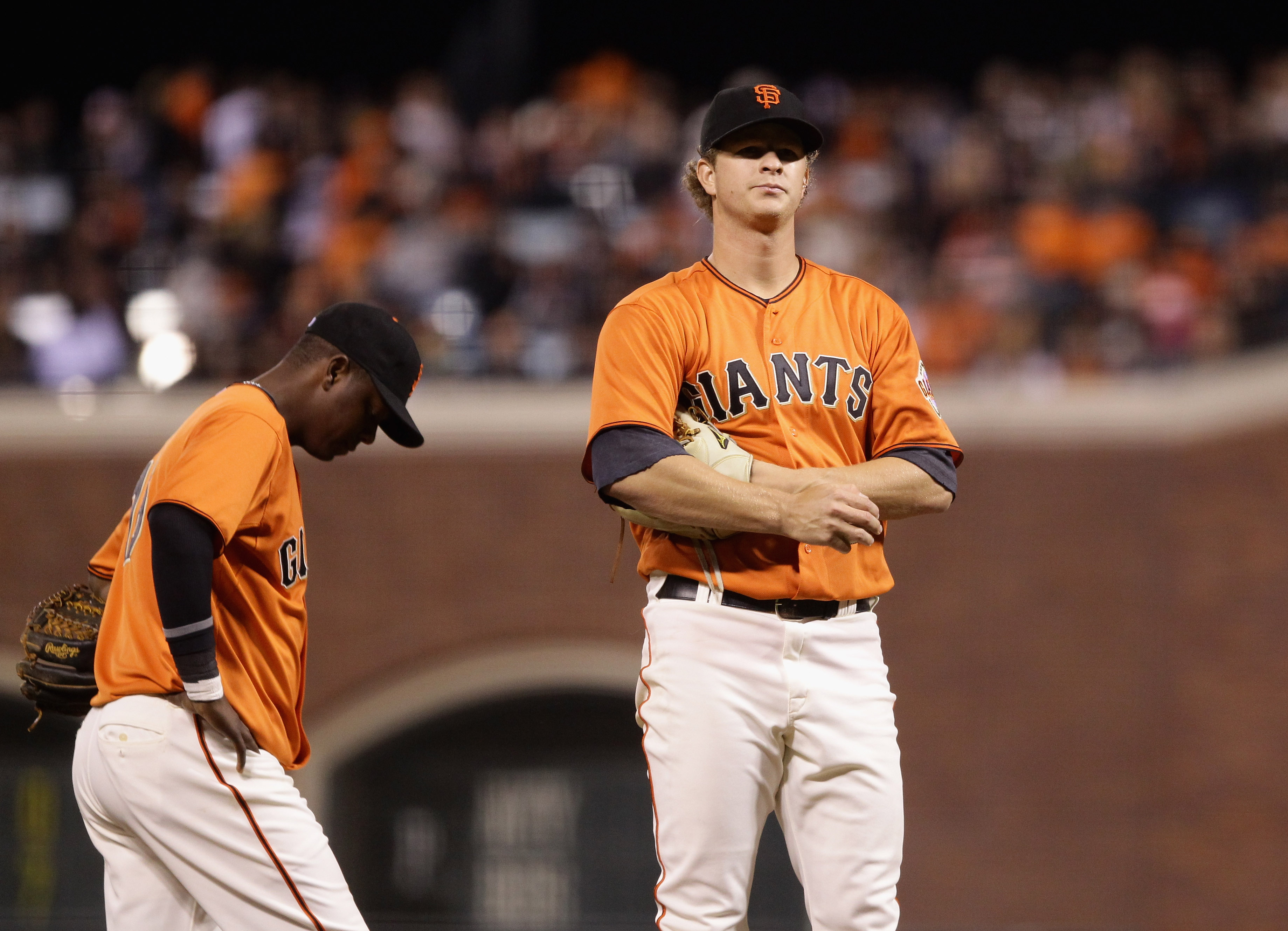 SAN FRANCISCO - OCTOBER 01:  Matt Cain #18 and Edgar Renteria #16 of the San Francisco Giants wait for manager Bruce Bochy to come to the mound to take Cain out of their game against the San Diego Padres in the fifth inning at AT&T Park on October 1, 2010