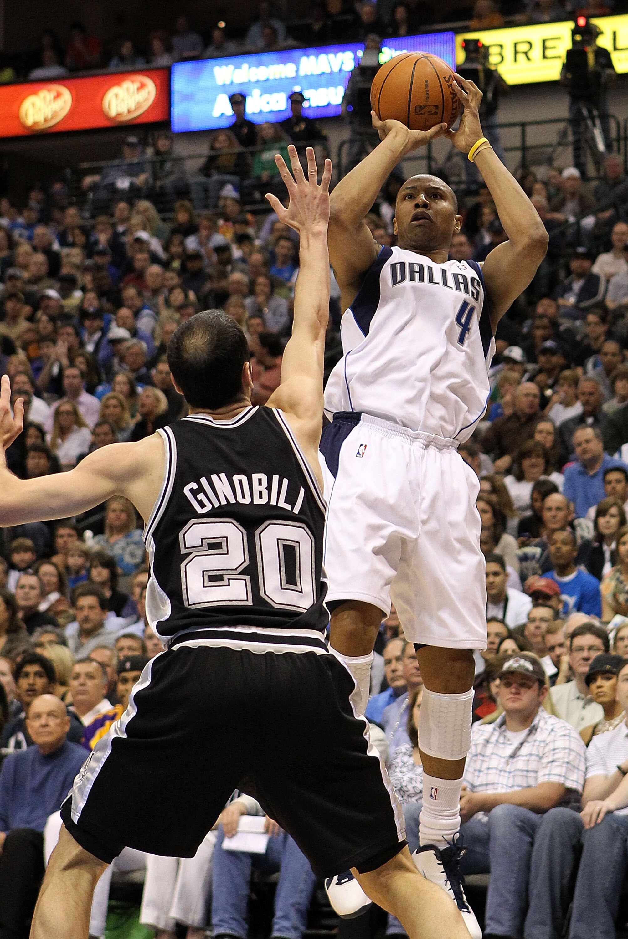 DALLAS - APRIL 18:  Forward Caron Butler #4 of the Dallas Mavericks takes a shot against Manu Ginobili #20 of the San Antonio Spurs in Game One of the Western Conference Quarterfinals during the 2010 NBA Playoffs at American Airlines Center on April 18, 2