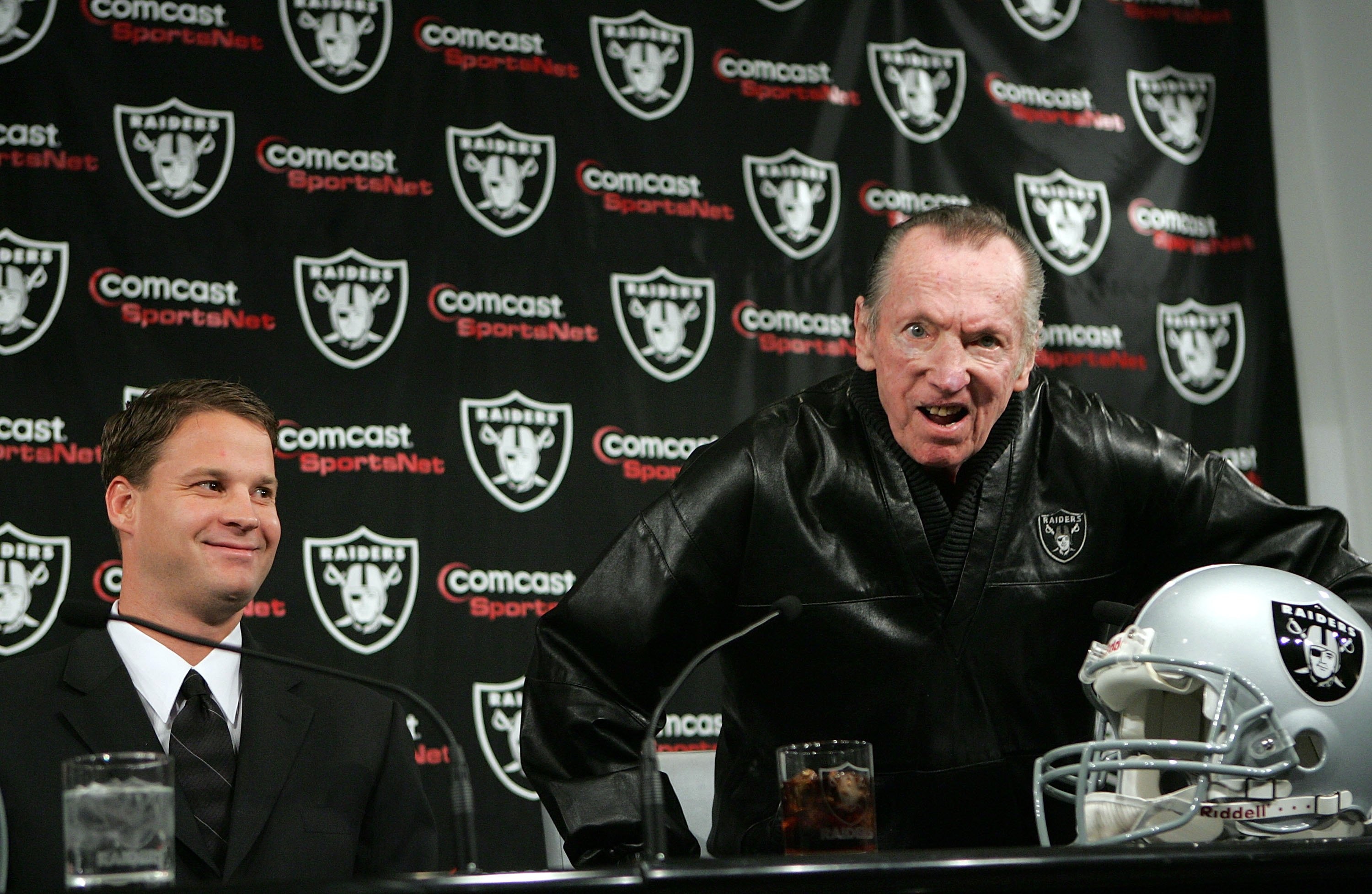 ALAMEDA, CA - JANUARY 23:  Newly hired head coach of the Oakland Raiders, Lane Kiffin (L), smiles as Raiders owner Al Davis reacts to a question during a press conference on January 23, 2007 in Alameda, California. Kiffin, a 31 year-old offensive coordina