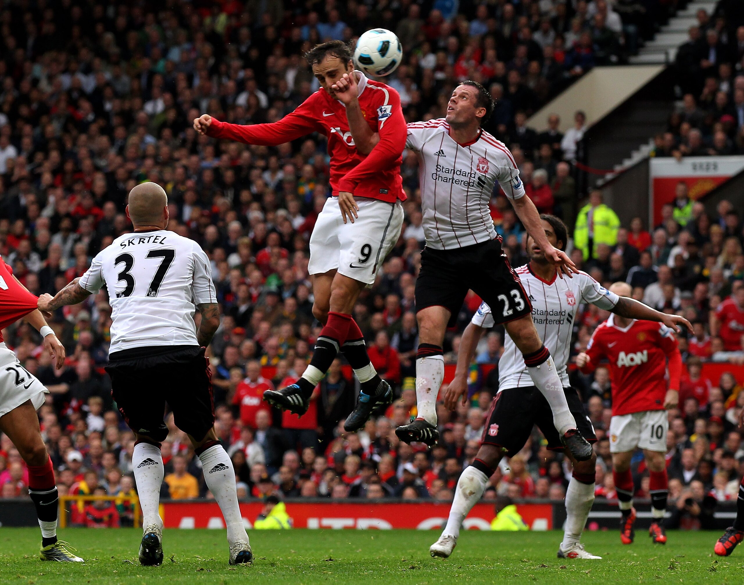 MANCHESTER, ENGLAND - SEPTEMBER 19: Dimitar Berbatov of Manchester United scores his team's third goal to complete his hat-trick during the Barclays Premier League match between Manchester United and Liverpool at Old Trafford on September 19, 2010 in Man MANCHESTER, ENGLAND - SEPTEMBER 19: Dimitar Berbatov of Manchester United scores his team's third goal to complete his hat-trick during the Barclays Premier League match between Manchester United and Liverpool at Old Trafford on September 19, 2010 in Man