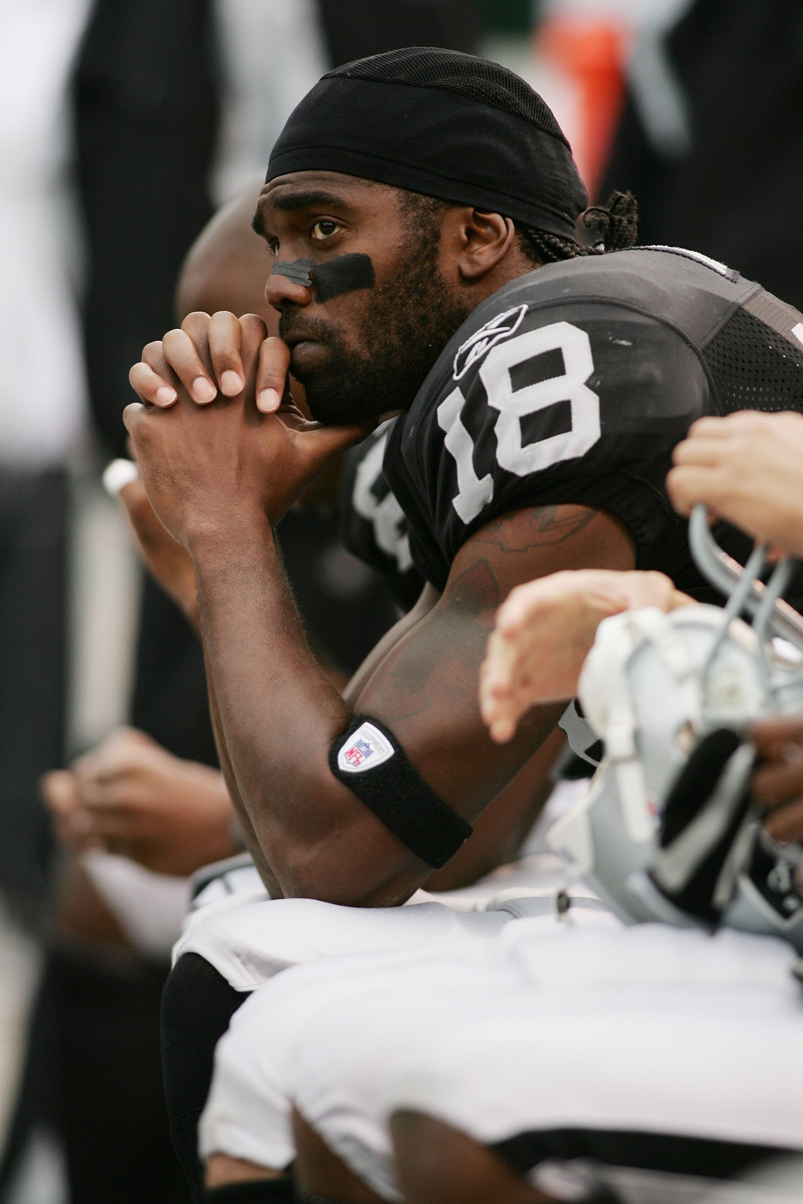 OAKLAND, CA - OCTOBER 01:  Randy Moss #18 of the Oakland Raiders looks on towards the end of the game against the Cleveland Browns on October 1, 2006 at McAfee Coliseum in Oakland, California. The Browns defeated the Raiders 24-21.  (Photo by Jonathan Fer
