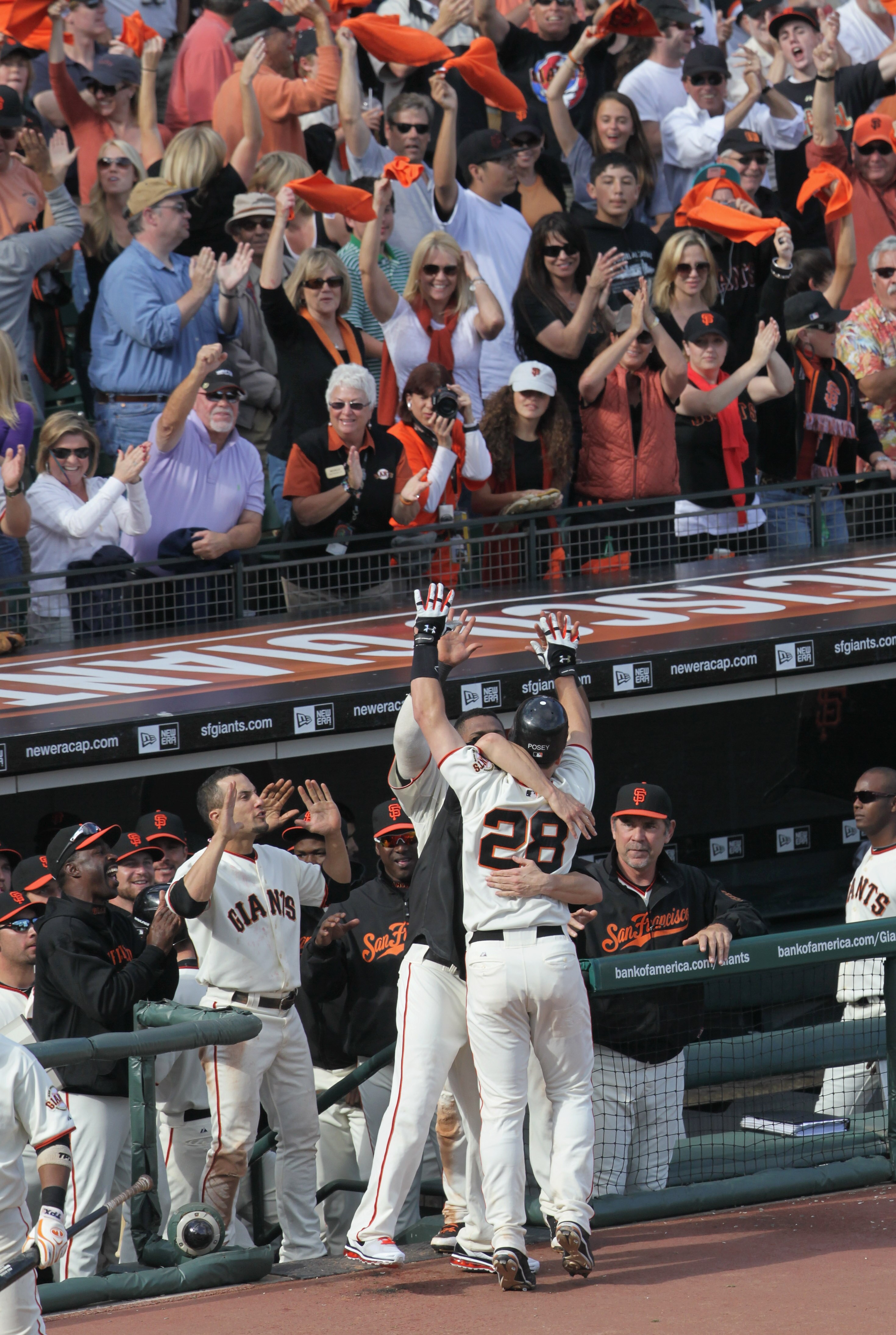 SAN FRANCISCO - OCTOBER 03:  Buster Posey #28 of the San Francisco Giants is congratulated by teammates after hitting a solo home run during the eighth inning against the San Diego Padres at AT&T Park on October 3, 2010 in San Francisco, California.  (Pho