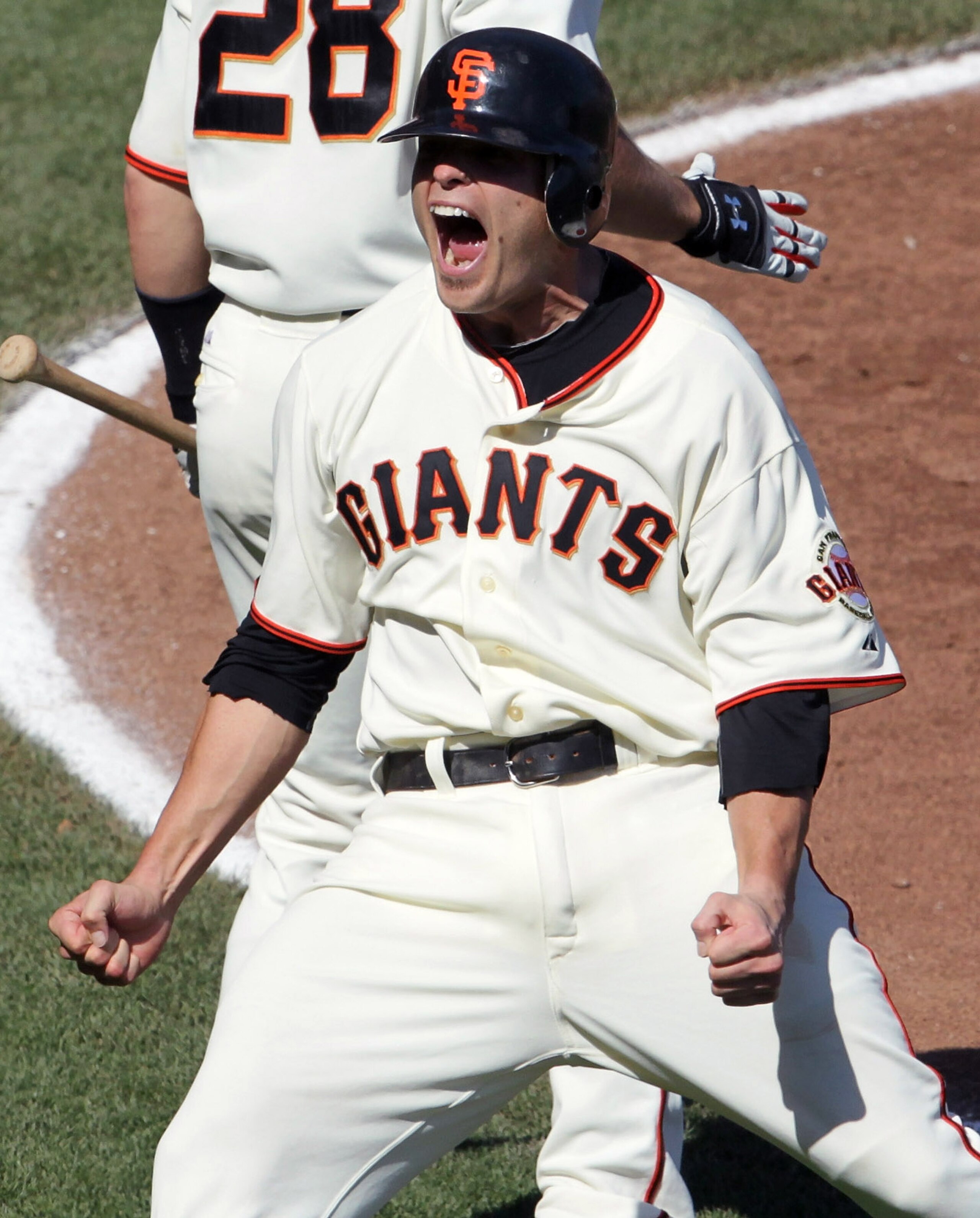 SAN FRANCISCO - OCTOBER 03:  Freddy Sanchez #21 of the San Francisco Giants celebrates after scoring a run during the third inning against the San Diego Padres at AT&T Park on October 3, 2010 in San Francisco, California.  (Photo by Justin Sullivan/Getty 