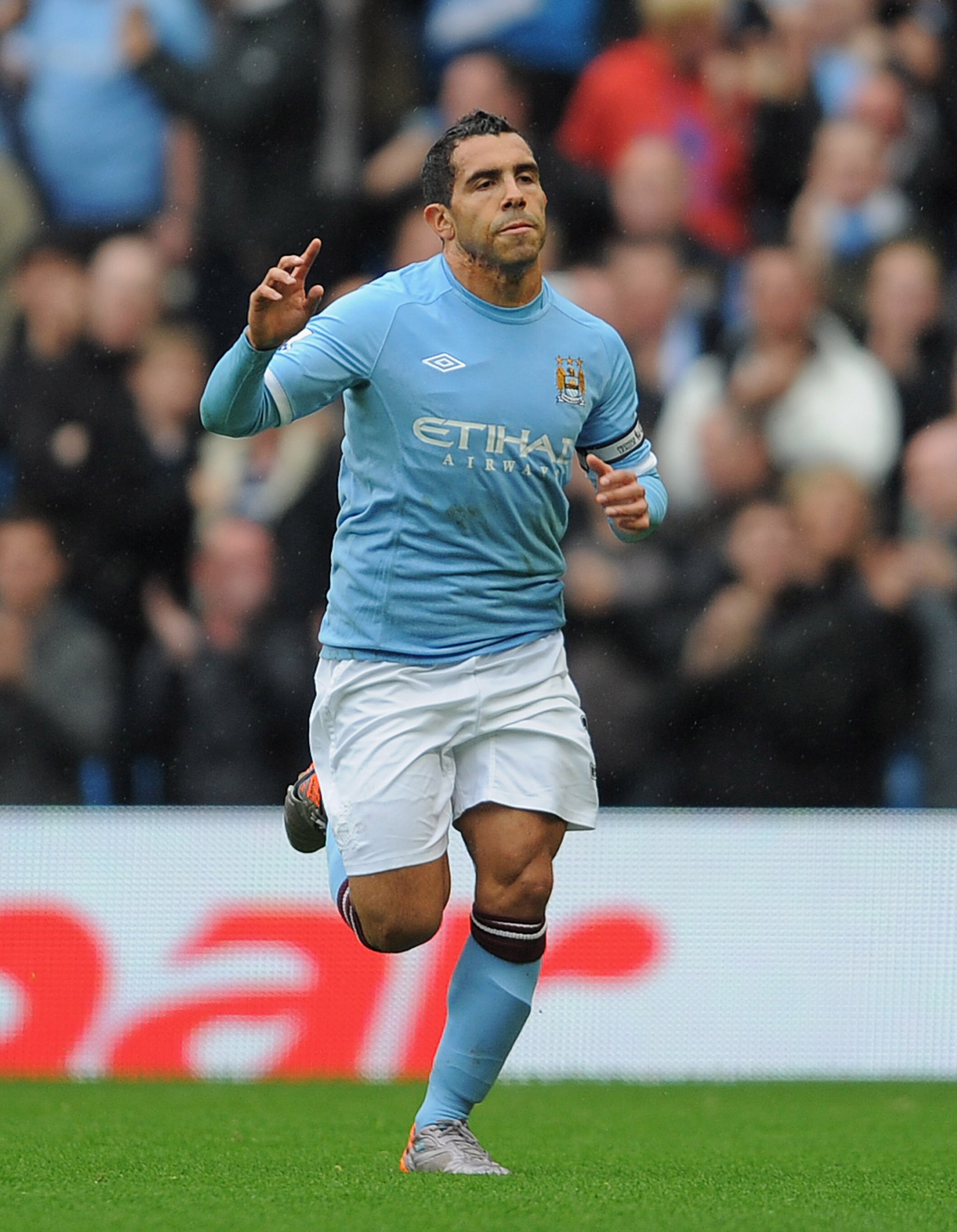 MANCHESTER, ENGLAND - OCTOBER 03:  Carlos Tevez of Manchester City celebrates scoring a penalty to make it 1-0 during the Barclays Premier League match between Manchester City and Newcastle United at the City of Manchester Stadium on October 3, 2010 in Ma