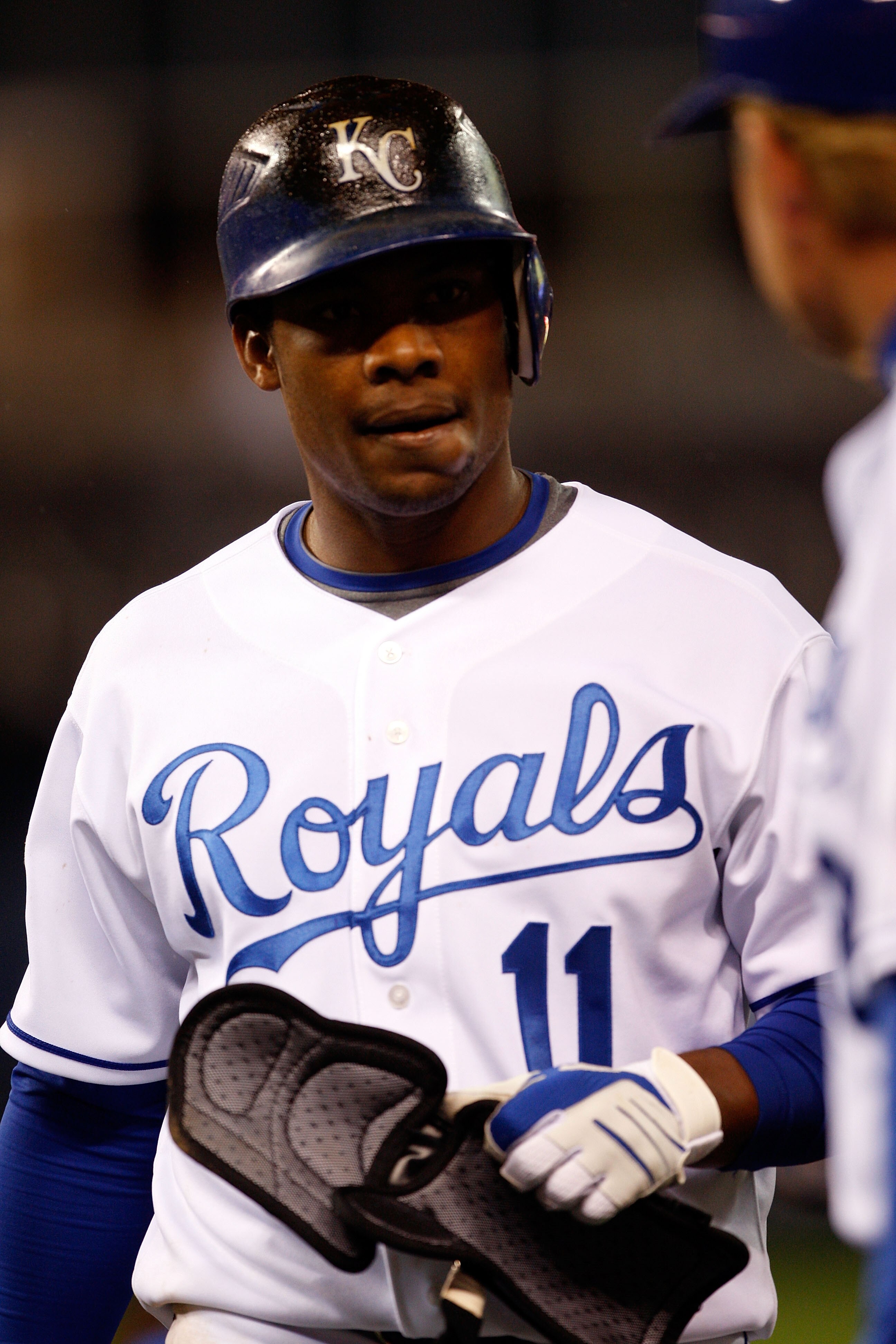 KANSAS CITY, MO - APRIL 27:  Jose Guillen #11 of  the Kansas City Royals walks back to the dugout with first base coach Rusty Kuntz #18 during action against the Toronto Blue Jays at Kauffman Stadium on April 27, 2009 in Kansas City, Missouri. Guillen hit