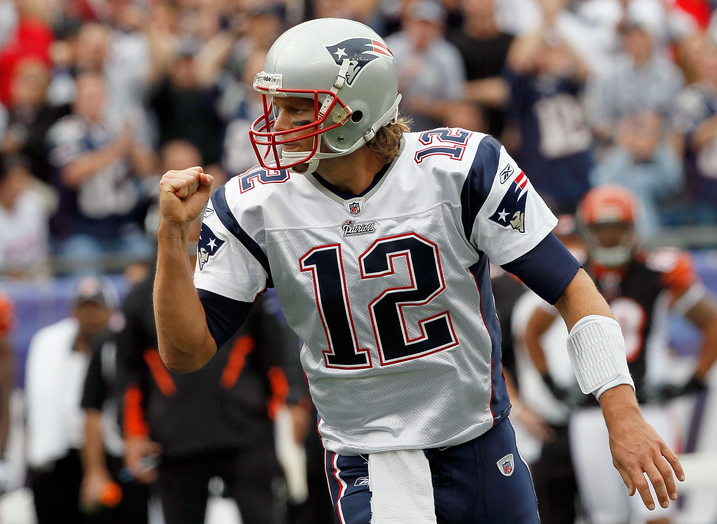 FOXBORO, MA - SEPTEMBER 12: Quarterback Tom Brady #12 reacts after teammate Wes Welker #83 scored a touchdown in the first quarter during the NFL season opener against the Cincinnati Bengals at Gillette Stadium on September 12, 2010 in Foxboro, Massachuse