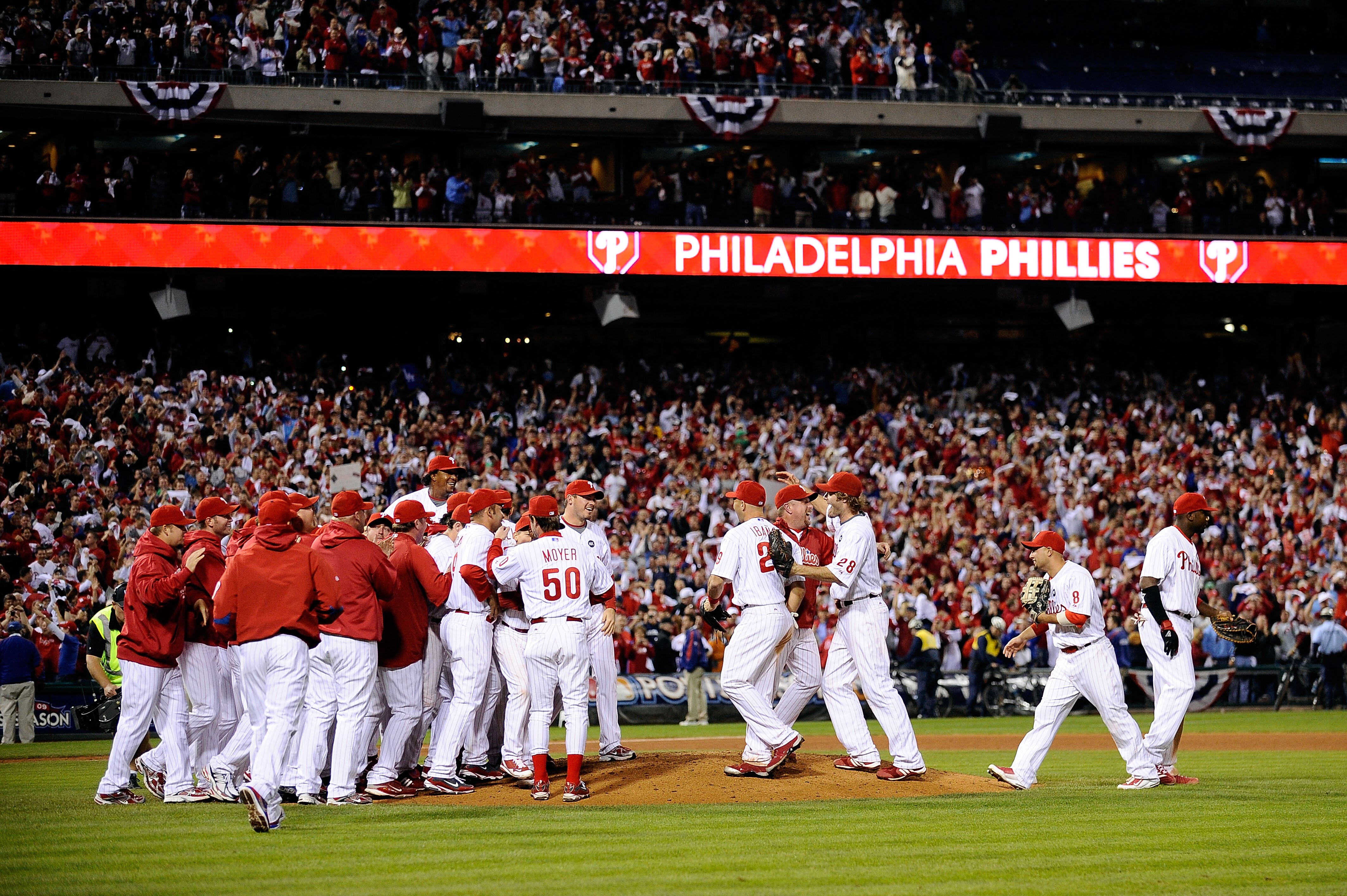 PHILADELPHIA - OCTOBER 21:  The Philadelphia Phillies celebrate defeating the Los Angeles Dodgers 10-4 to advance to the World Series in Game Five of the NLCS during the 2009 MLB Playoffs at Citizens Bank Park on October 21, 2009 in Philadelphia, Pennsylv