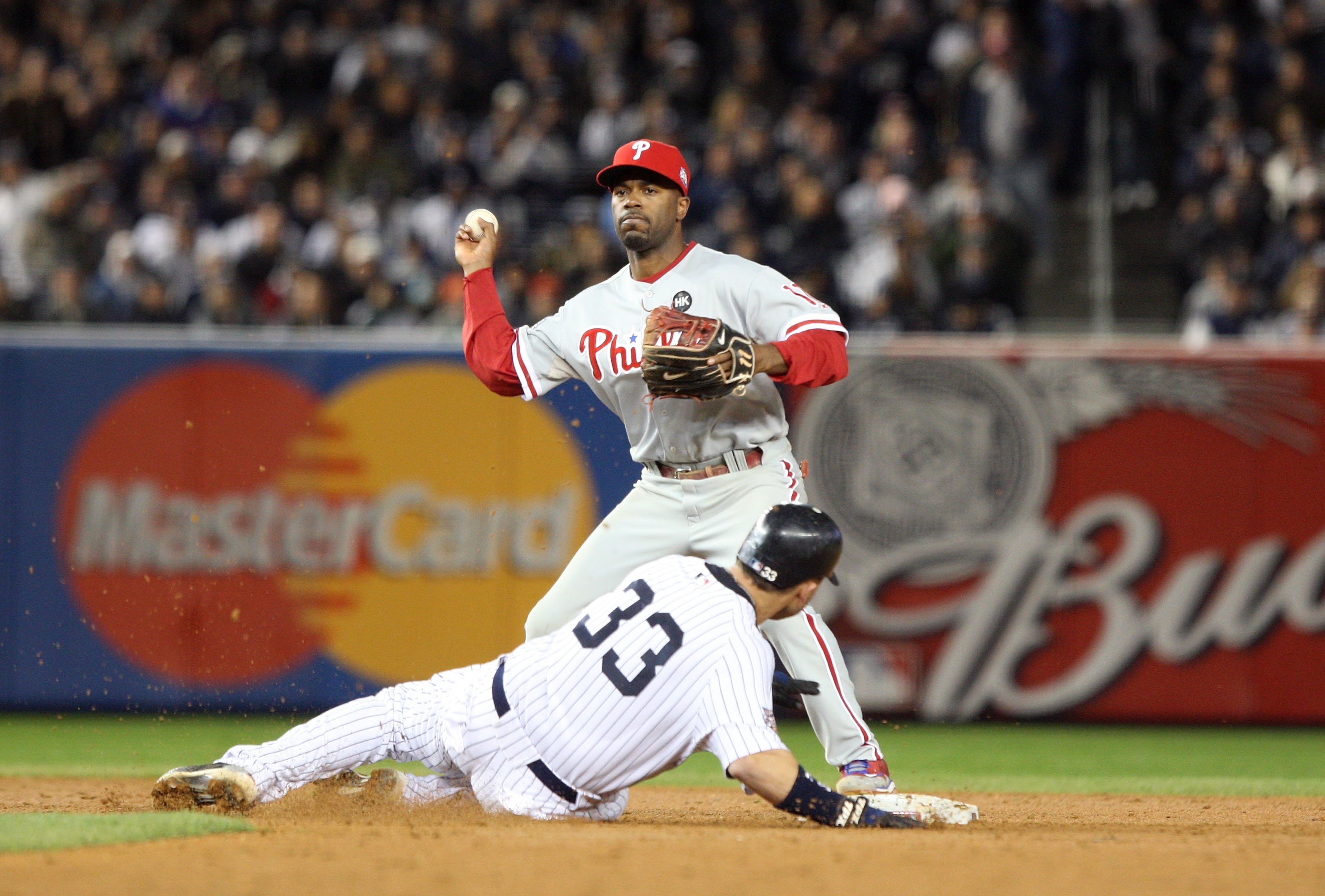 NEW YORK - NOVEMBER 04:  Jimmy Rollins #11 of the Philadelphia Phillies forces out Nick Swisher #33 of the New York Yankees on a fielder's choice in the bottom of the sixth inning of Game Six of the 2009 MLB World Series at Yankee Stadium on November 4, 2
