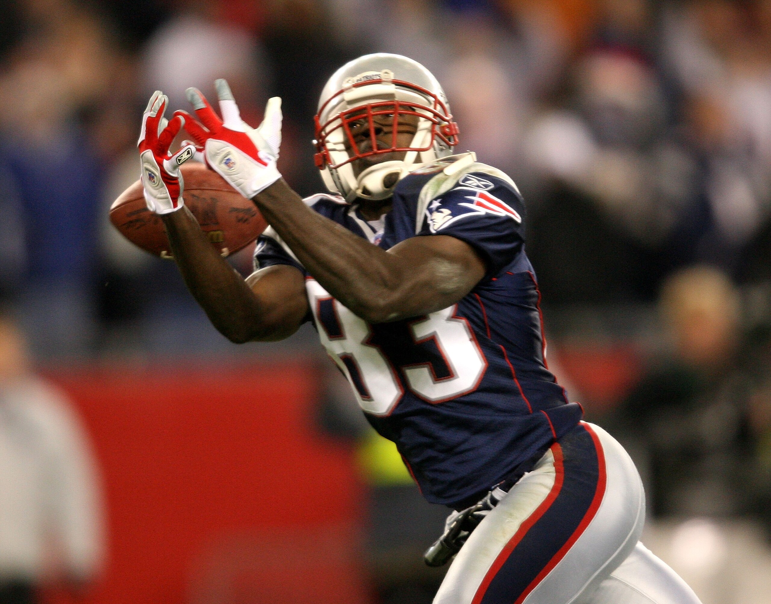 FOXBORO, MA - JANUARY 7:  Deion Branch #83 of the new England Patriots can't hang onto a pass in the second quarter during their Wild Card Playoff game against the Jacksonville Jaguars on January 7, 2006 at Gillette Stadium in Foxboro, Massachusetts.  (Ph