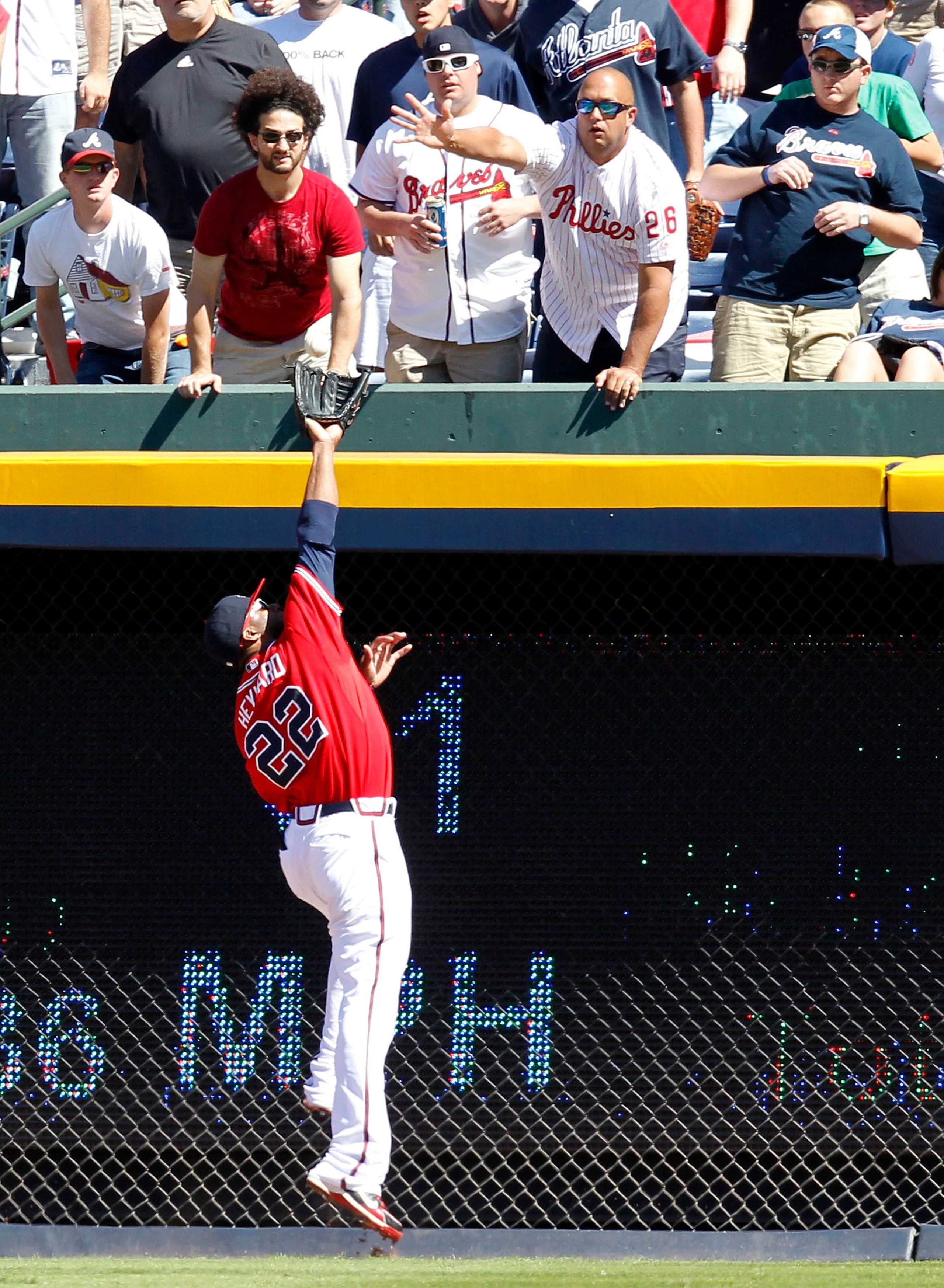 ATLANTA - OCTOBER 3: Outfielder Jason Heyward #22 of the Atlanta Braves catches a fly ball against the wall during the game against the Philadelphia Phillies at Turner Field on October 3, 2010 in Atlanta, Georgia. The Braves beat the Phillies 8-7. (Pho ATLANTA - OCTOBER 3: Outfielder Jason Heyward #22 of the Atlanta Braves catches a fly ball against the wall during the game against the Philadelphia Phillies at Turner Field on October 3, 2010 in Atlanta, Georgia. The Braves beat the Phillies 8-7. (Pho