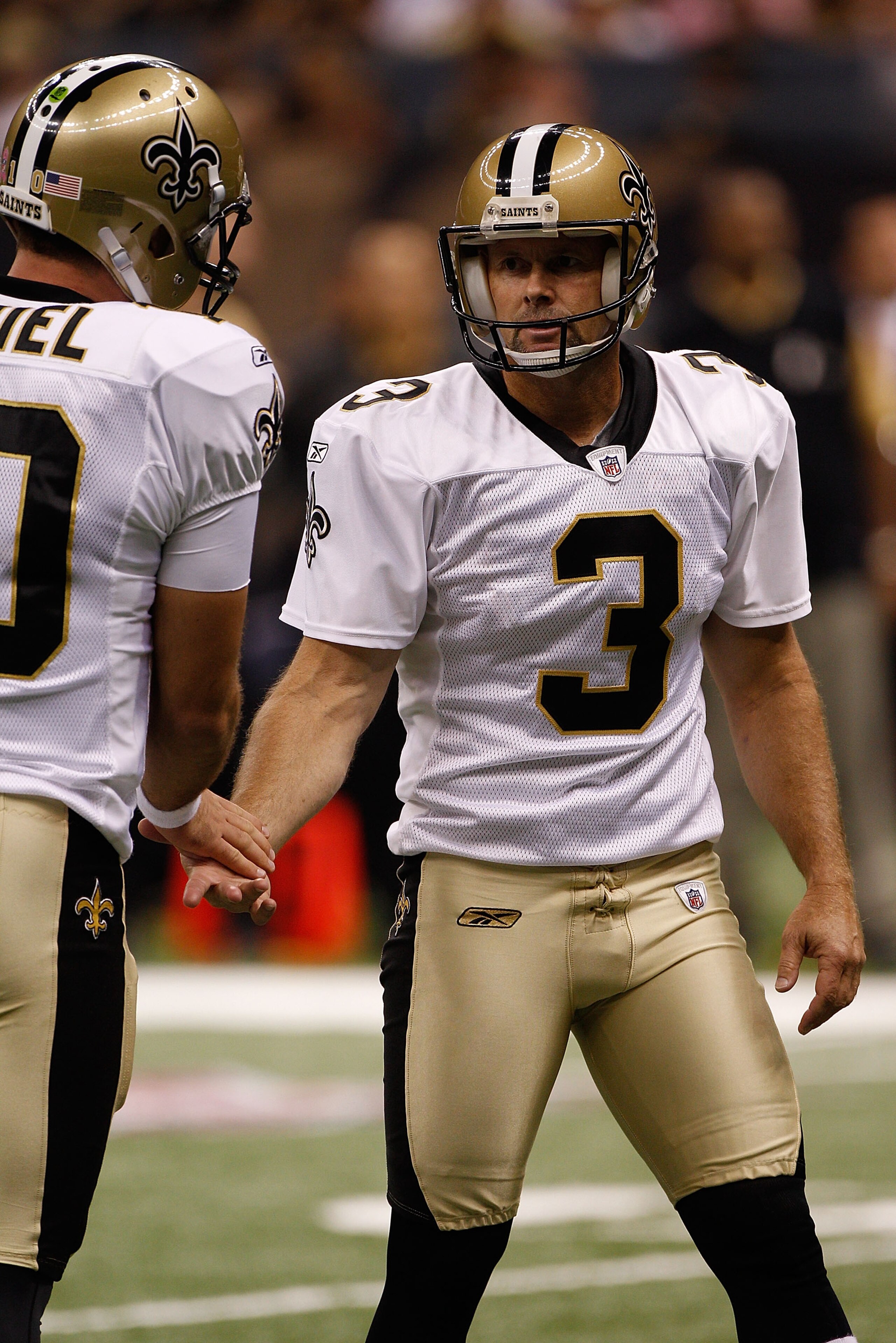 NEW ORLEANS - OCTOBER 03:  Chase Daniel #10 and John Carney #3 of the New Orleans Saints celebrate after a field goal by Carney during the game against the Carolina Panthers at the Louisiana Superdome on October 3, 2010 in New Orleans, Louisiana.  (Photo 