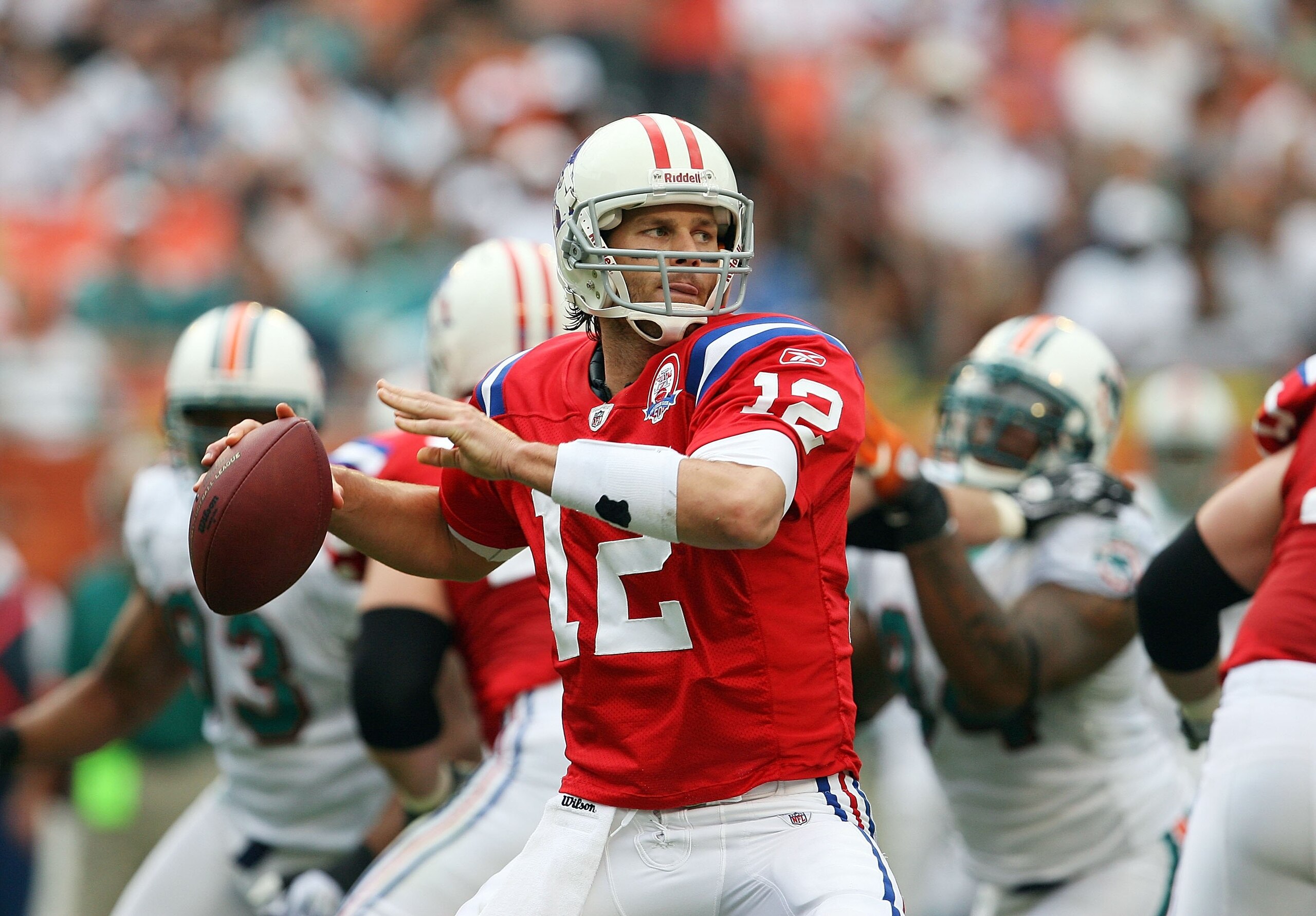 MIAMI - DECEMBER 06: Quarterback Tom Brady #12 of the New England Patriots drops back to pass against the Miami Dolphins at Land Shark Stadium on December 6, 2009 in Miami, Florida. The Dolphins defeated the Patriots 22-21. (Photo by Doug Benc/Getty Ima MIAMI - DECEMBER 06: Quarterback Tom Brady #12 of the New England Patriots drops back to pass against the Miami Dolphins at Land Shark Stadium on December 6, 2009 in Miami, Florida. The Dolphins defeated the Patriots 22-21. (Photo by Doug Benc/Getty Ima