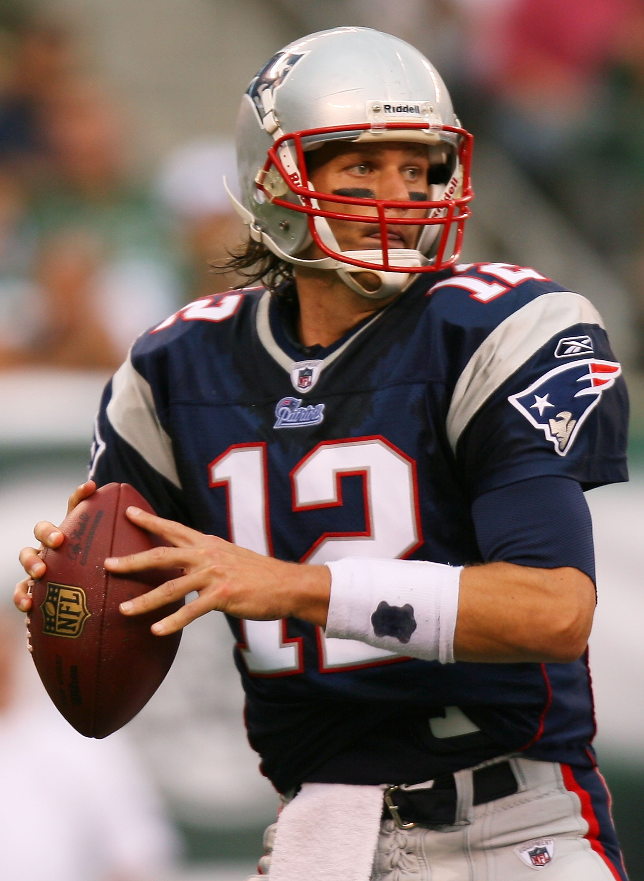 EAST RUTHERFORD, NJ - SEPTEMBER 19:  Tom Brady #12 of the New England Patriots drops back to pass against the New York Jets at the New Meadowlands Stadium on September 19, 2010 in East Rutherford, New Jersey.  (Photo by Andrew Burton/Getty Images)