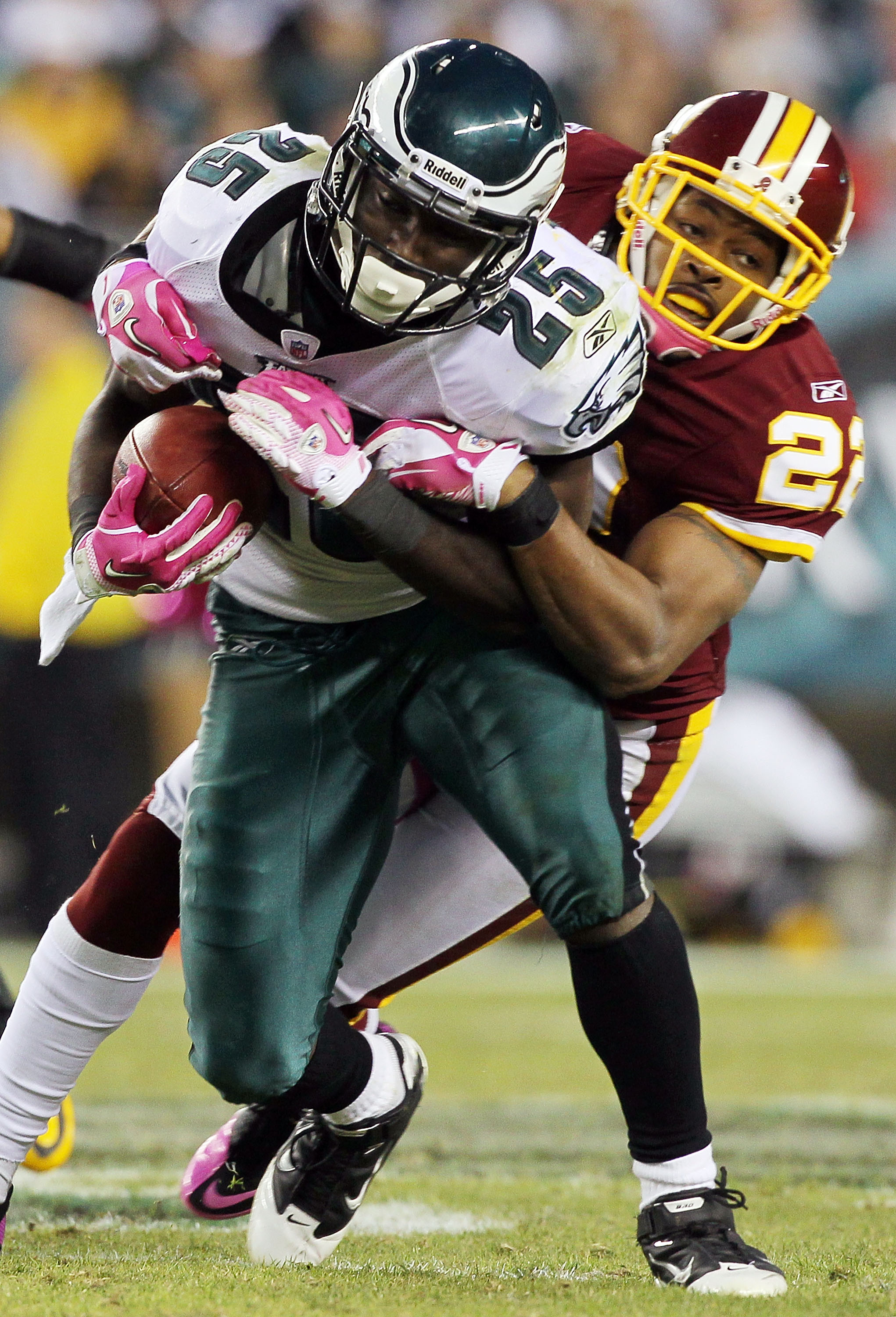 PHILADELPHIA - OCTOBER 03:  LeSean McCoy #25 of the Philadelphia Eagles is tackled by Carlos Rogers #22 of the Washington Redskins on October 3, 2010 at Lincoln Financial Field in Philadelphia, Pennsylvania. The Redskins defeated the Eagles 17-12.  (Photo