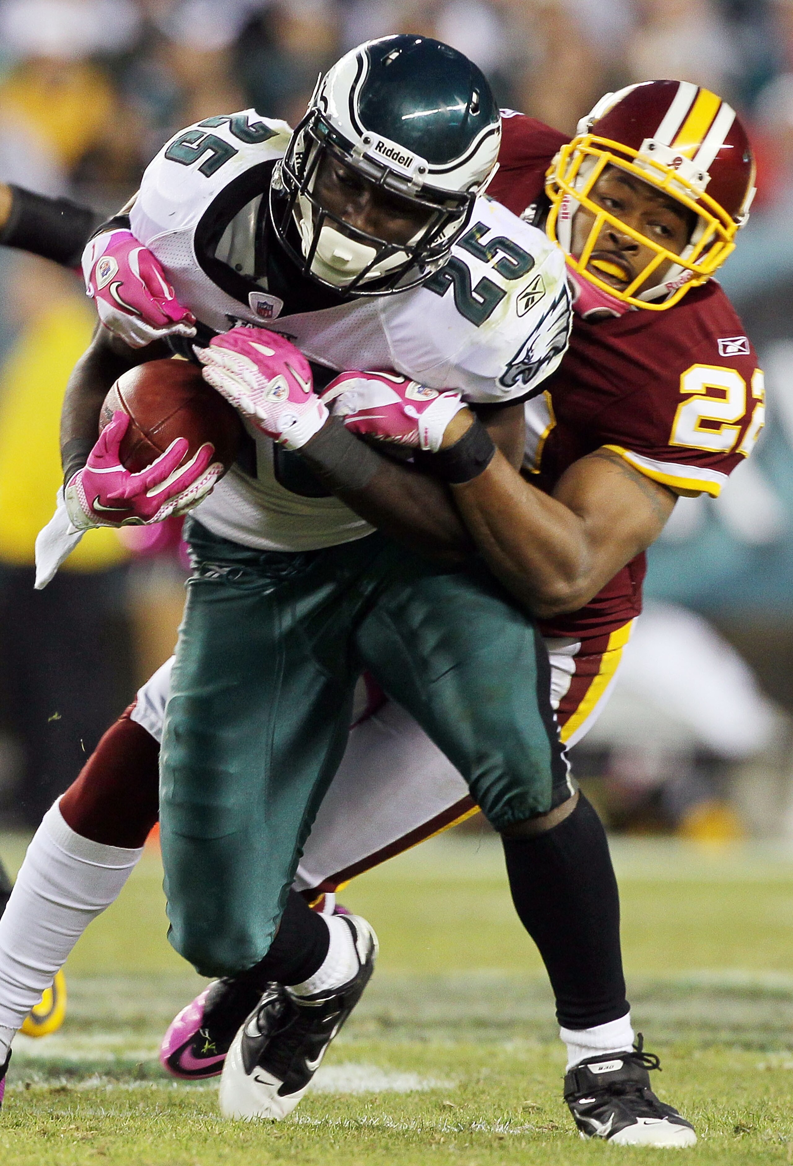 PHILADELPHIA - OCTOBER 03:  LeSean McCoy #25 of the Philadelphia Eagles is tackled by Carlos Rogers #22 of the Washington Redskins on October 3, 2010 at Lincoln Financial Field in Philadelphia, Pennsylvania. The Redskins defeated the Eagles 17-12.  (Photo