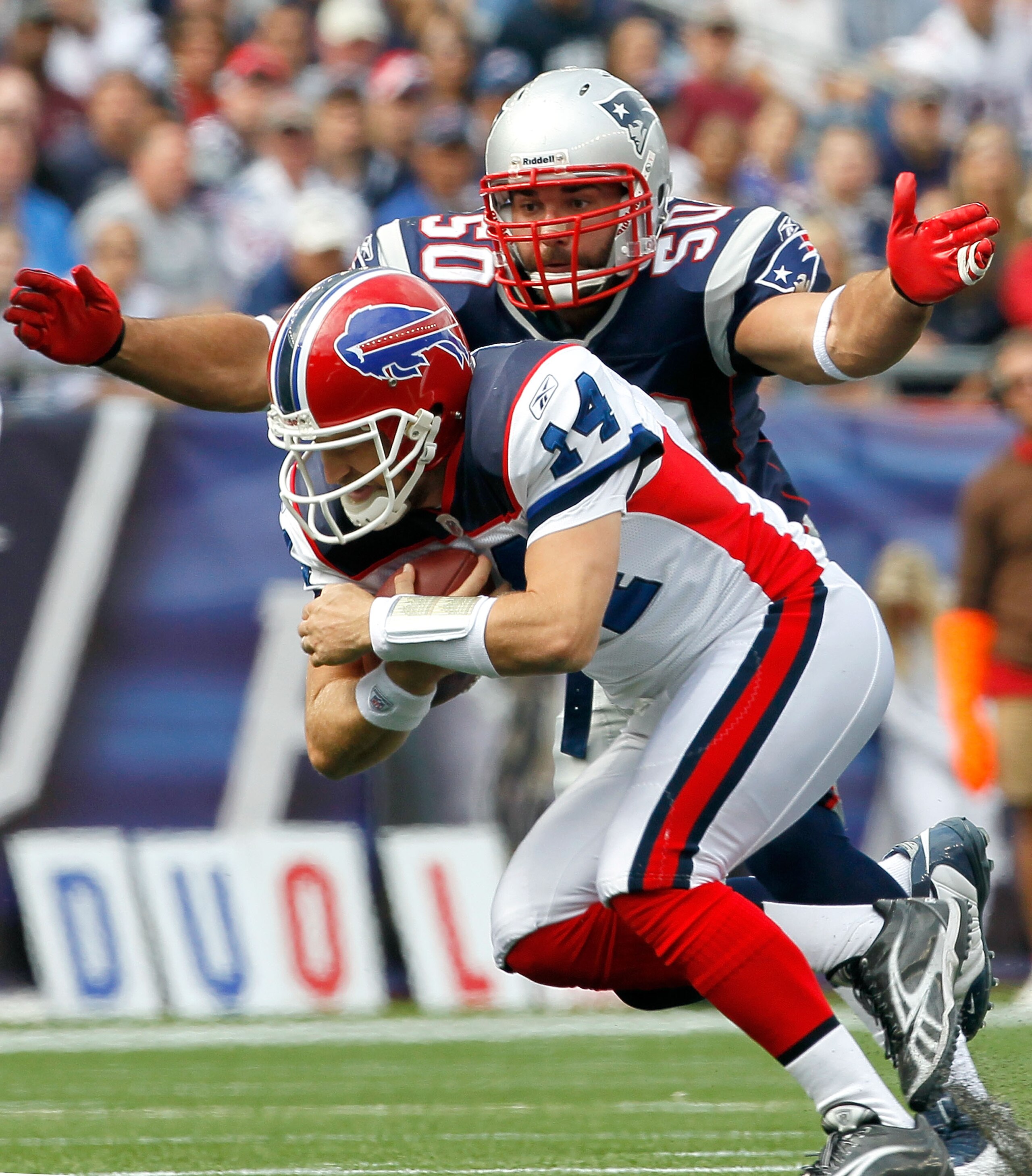 FOXBORO, MA - SEPTEMBER 26: Rob Ninkovich #50 of the New England Patriots tackles quarterback Ryan Fitzpatrick #14 of the Buffalo Bills at Gillette Stadium on September 26, 2010 in Foxboro, Massachusetts. (Photo by Jim Rogash/Getty Images) FOXBORO, MA - SEPTEMBER 26: Rob Ninkovich #50 of the New England Patriots tackles quarterback Ryan Fitzpatrick #14 of the Buffalo Bills at Gillette Stadium on September 26, 2010 in Foxboro, Massachusetts. (Photo by Jim Rogash/Getty Images)