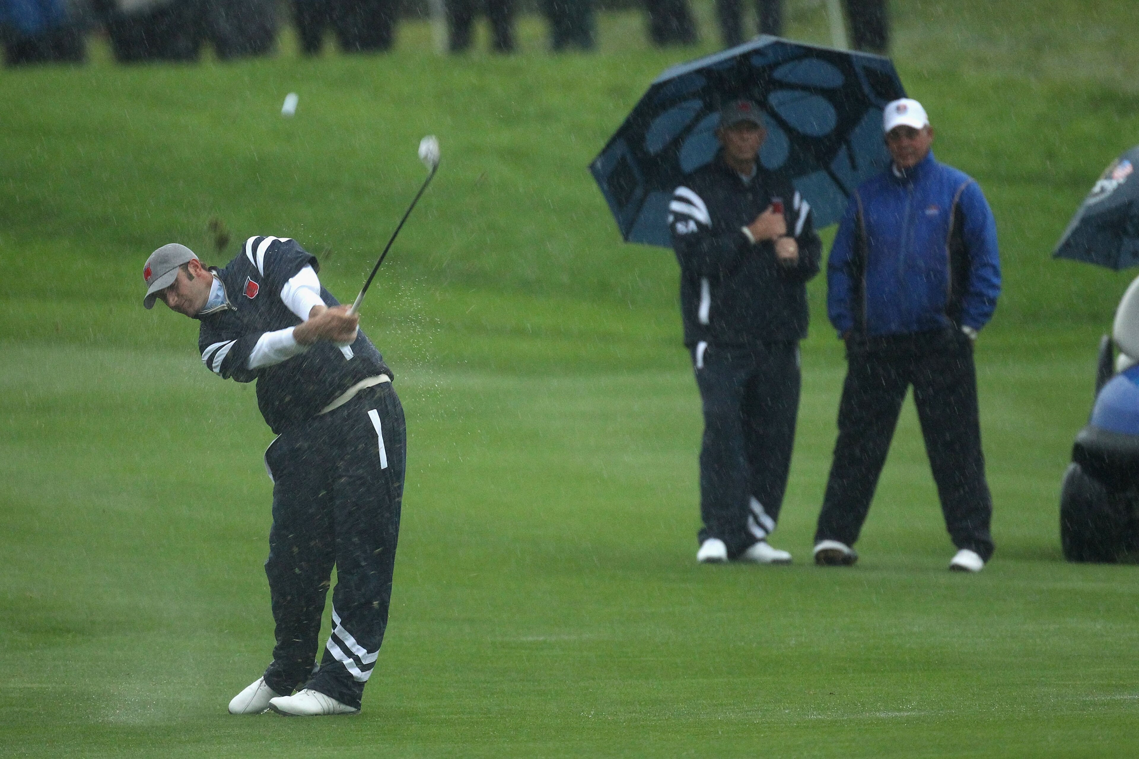NEWPORT, WALES - OCTOBER 01:  Dustin Johnson of the USA hits a shot on the second hole as the rain falls during the Morning Fourball Matches during the 2010 Ryder Cup at the Celtic Manor Resort on October 1, 2010 in Newport, Wales.  (Photo by Ross Kinnair