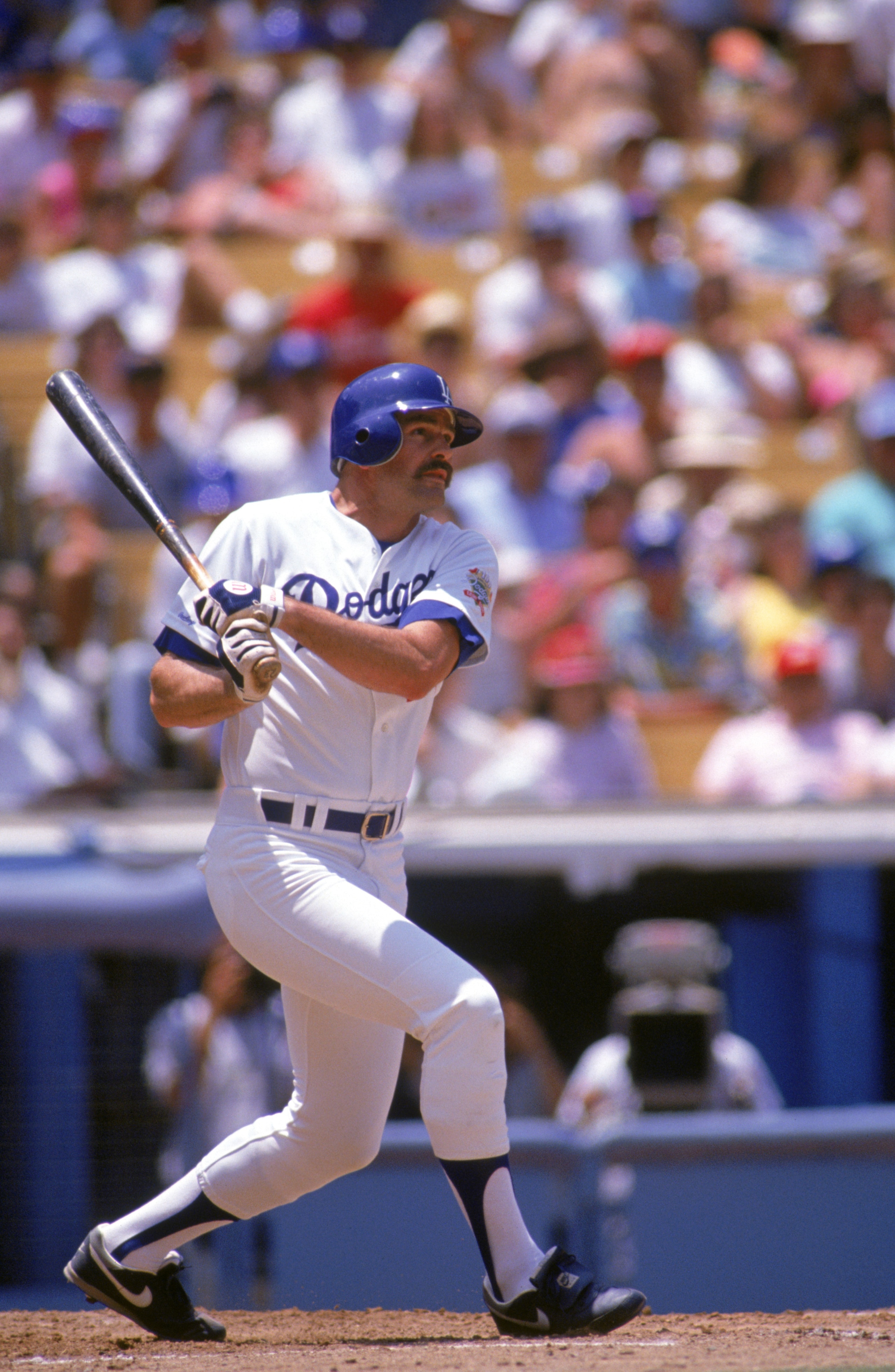 LOS ANGELES - 1990:  Kirk Gibson #23 of the Los Angeles Dodgers swings at a pitch during a 1990 game at Dodger Stadium in Los Angeles, California. (Photo by Ken Levine/Getty Images)