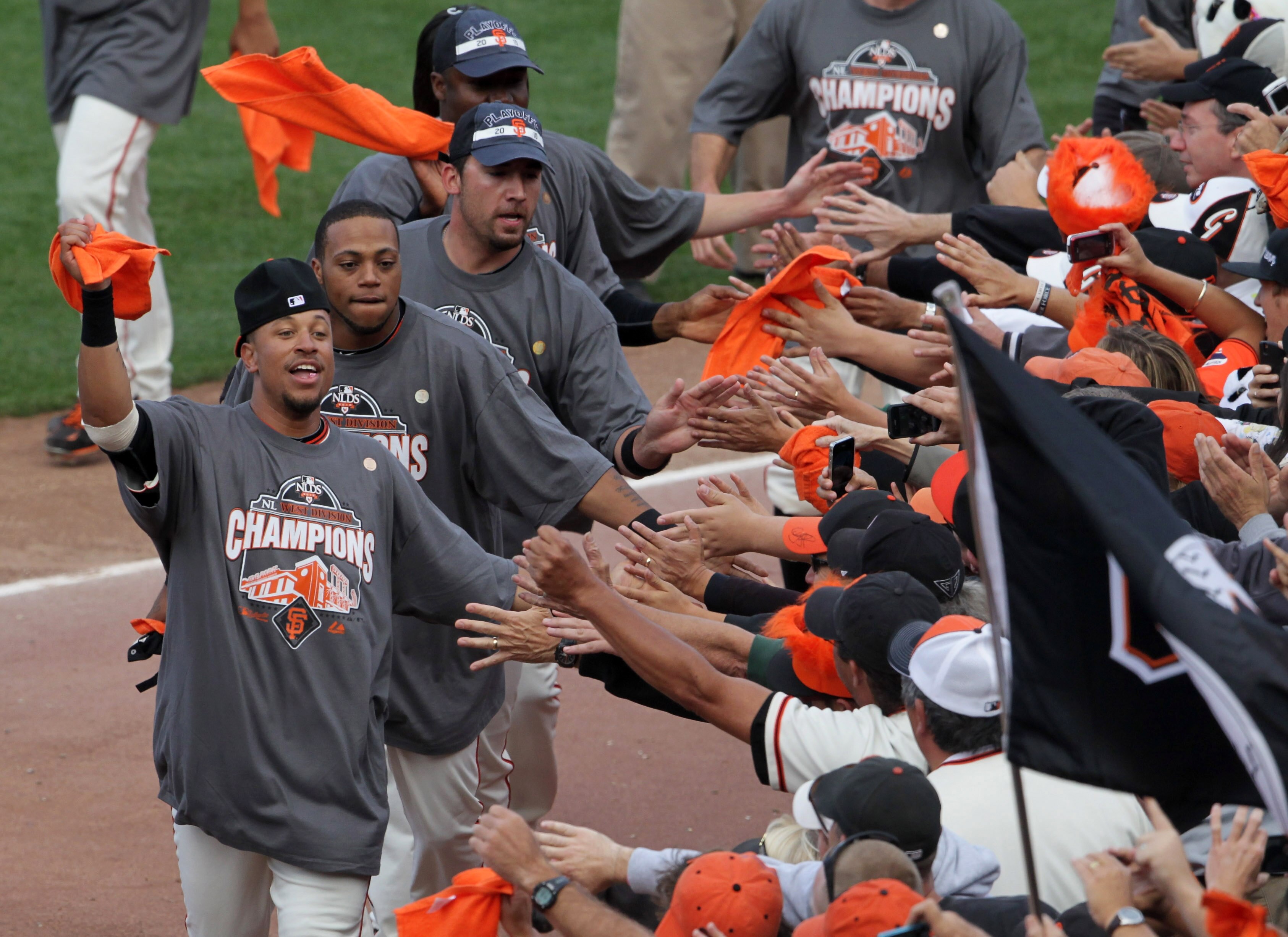 SAN FRANCISCO - OCTOBER 03: San Francisco Giants players greet fans after the Giants clinched the National League West divsion against the San Diego Padres at AT&T Park on October 3, 2010 in San Francisco, California.  The Giants beat the Padres 3-0.  (Ph