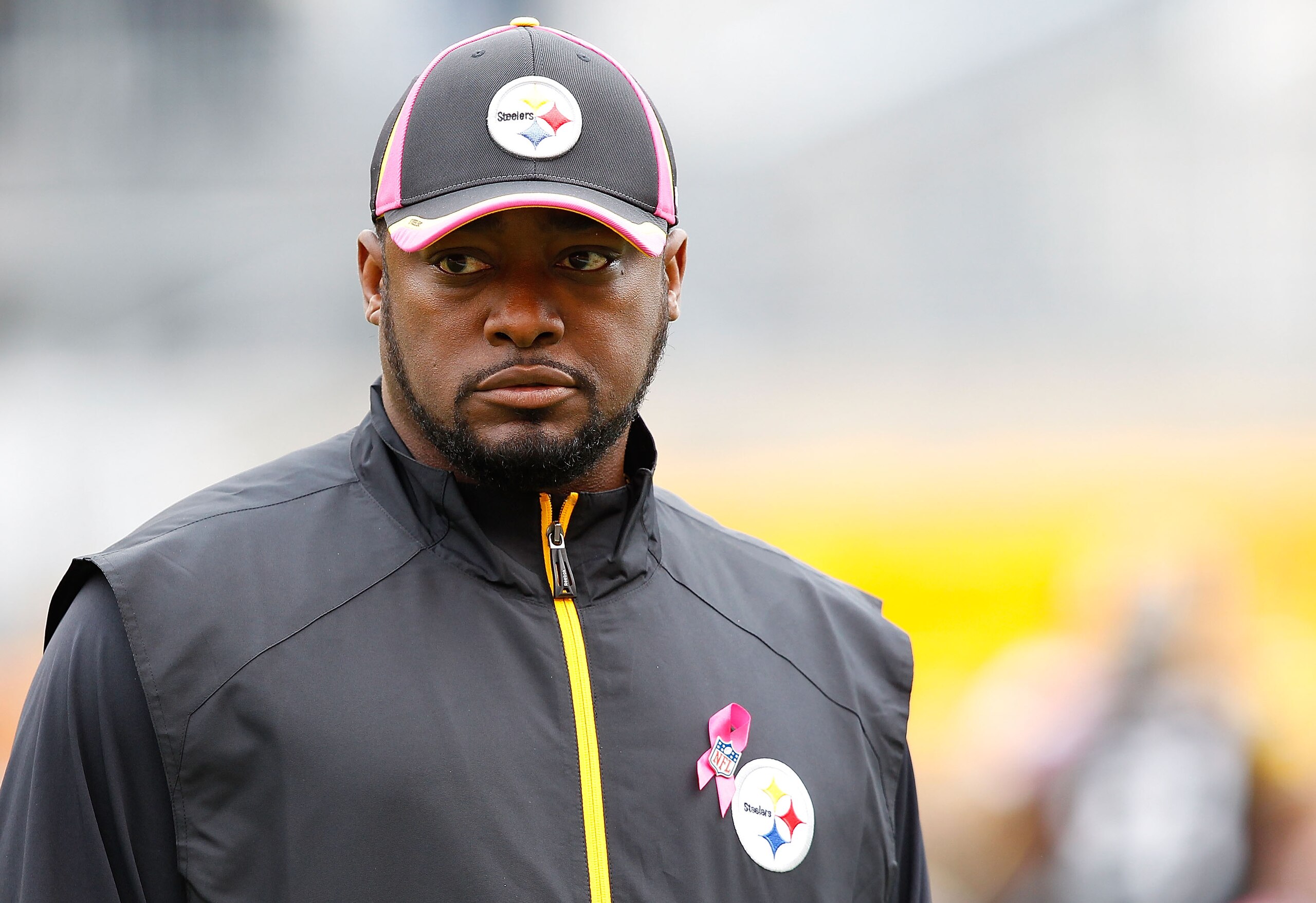PITTSBURGH - OCTOBER 03:  Head coach Mike Tomlin of the Pittsburgh Steelers wears a pink hat for breast cancer awareness as he watches his team practice prior to the game against the Baltimore Ravens on October 3, 2010 at Heinz Field in Pittsburgh, Pennsy