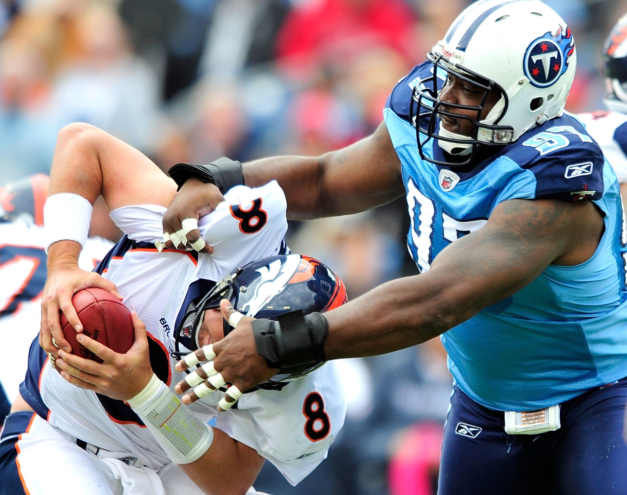 NASHVILLE, TN - OCTOBER 03:  Tony Brown #97 of the Tennessee Titans sacks quarterback Kyle Orton #8 of the Denver Broncos during the first half at LP Field on October 3, 2010 in Nashville, Tennessee.  (Photo by Grant Halverson/Getty Images)