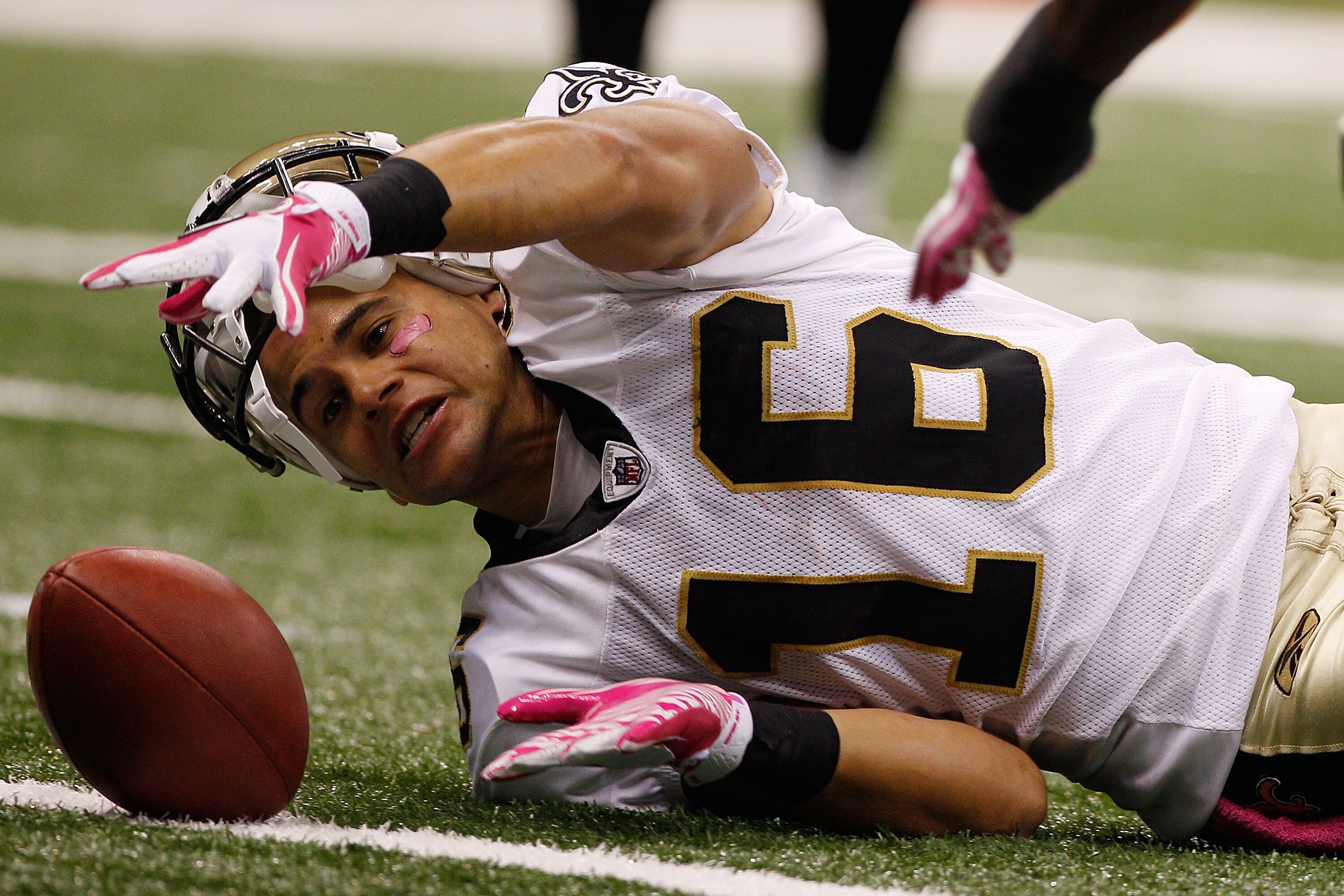 NEW ORLEANS - OCTOBER 03:  Lance Moore #16 of the New Orleans Saints reaches for the ball after a fumble during the game against the Carolina Panthers at the Louisiana Superdome on October 3, 2010 in New Orleans, Louisiana.  (Photo by Chris Graythen/Getty