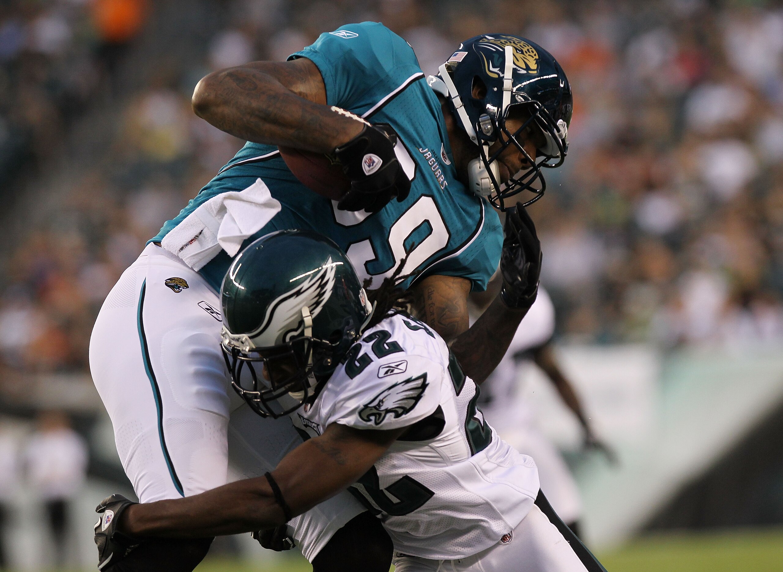 PHILADELPHIA - AUGUST 13: Marcedes Lewis #89 of the Jacksonville Jaguars is tackled by Asante Samuel #22 of the Philadelphia Eagles during their preseason game at Lincoln Financial Field on August 13, 2010 in Philadelphia, Pennsylvania.  (Photo by Nick La