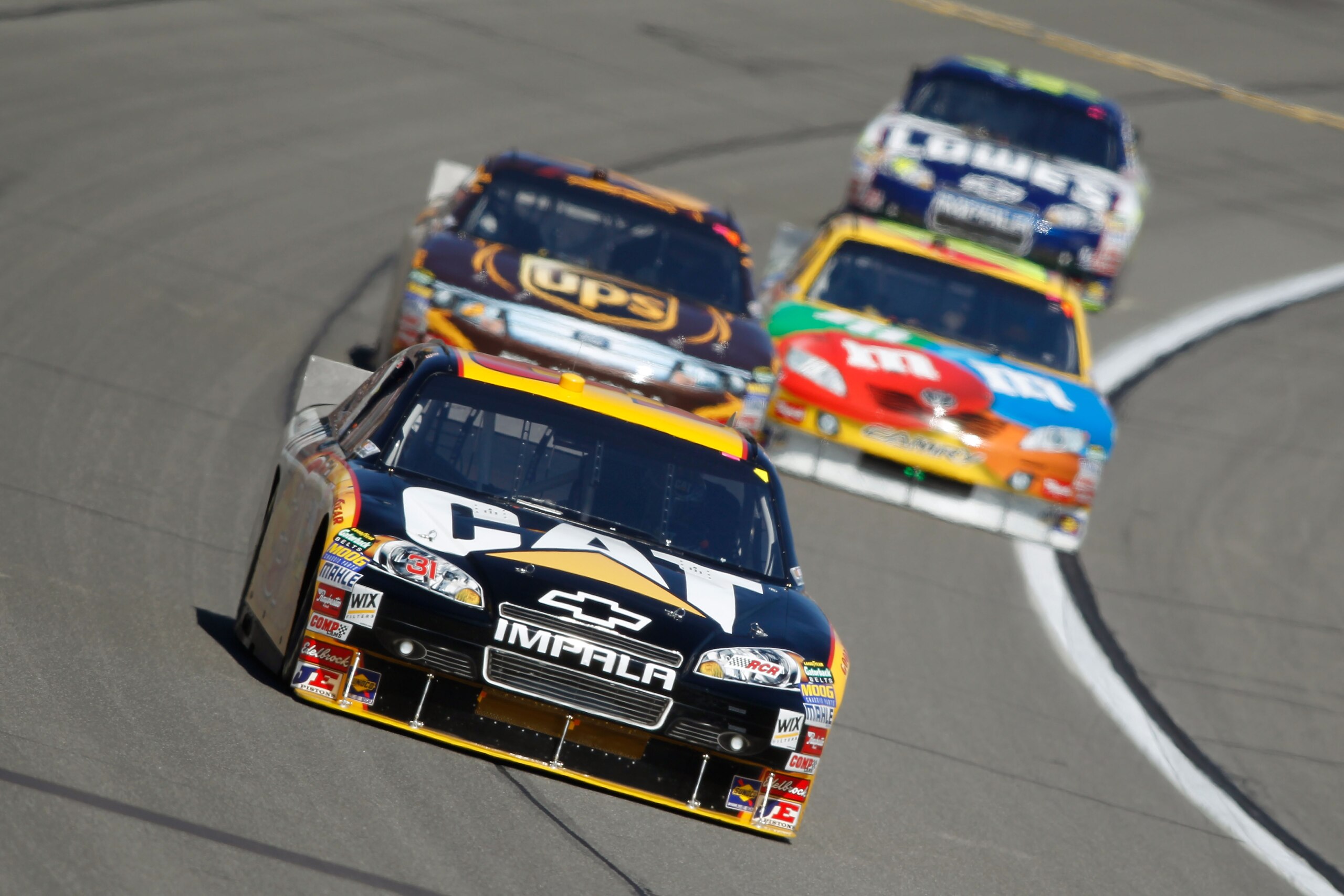 KANSAS CITY, KS - OCTOBER 03:  Jeff Burton, driver of the #31 Caterpilliar Chevrolet, leads a line of cars during the NASCAR Sprint Cup Series Price Chopper 400 on October 3, 2010 in Kansas City, Kansas.  (Photo by Todd Warshaw/Getty Images)