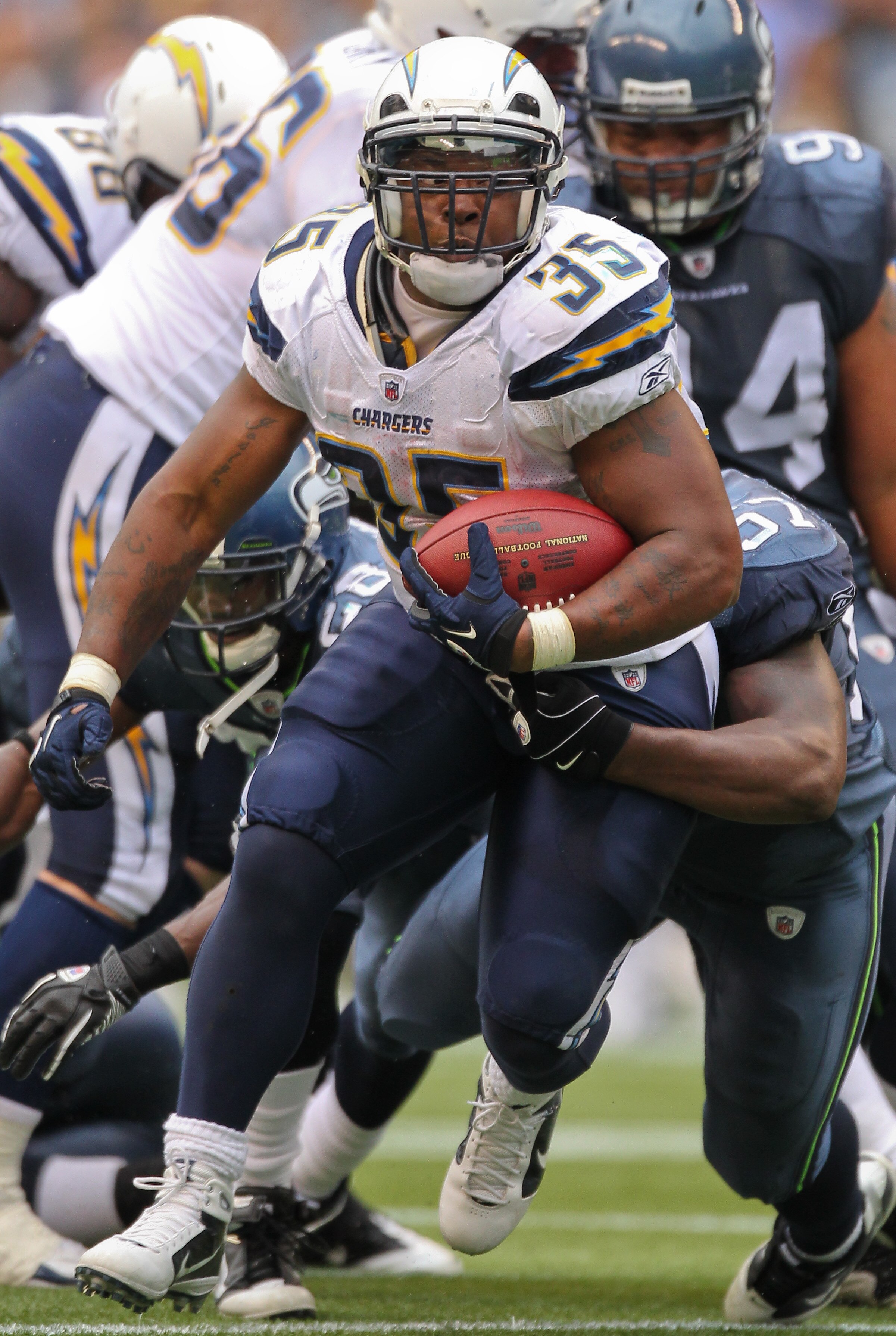 SEATTLE - SEPTEMBER 26:  Running back Mike Tolbert #35 of the San Diego Chargers rushes against the Seattle Seahawks at Qwest Field on September 26, 2010 in Seattle, Washington. (Photo by Otto Greule Jr/Getty Images)