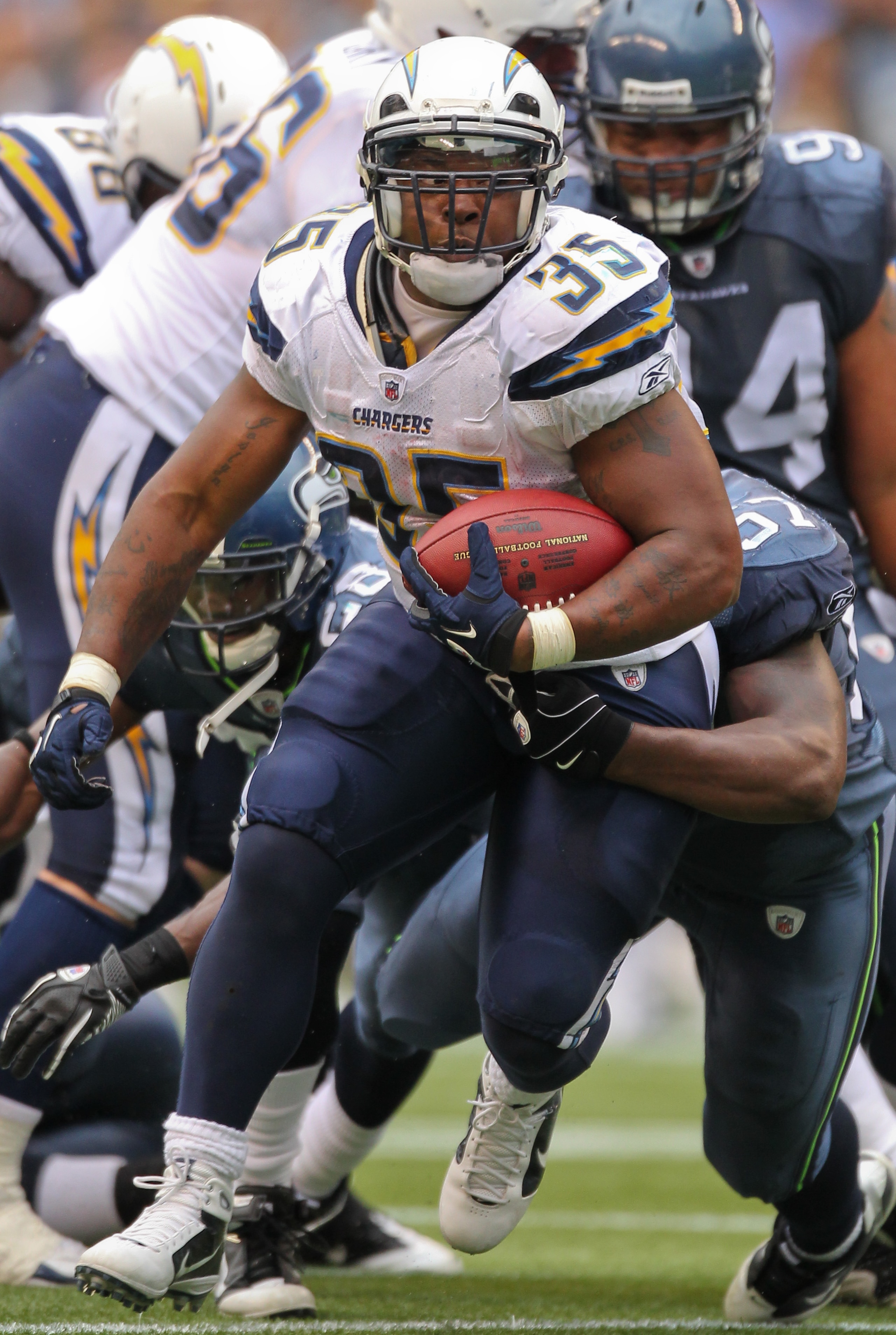 SEATTLE - SEPTEMBER 26:  Running back Mike Tolbert #35 of the San Diego Chargers rushes against the Seattle Seahawks at Qwest Field on September 26, 2010 in Seattle, Washington. (Photo by Otto Greule Jr/Getty Images)
