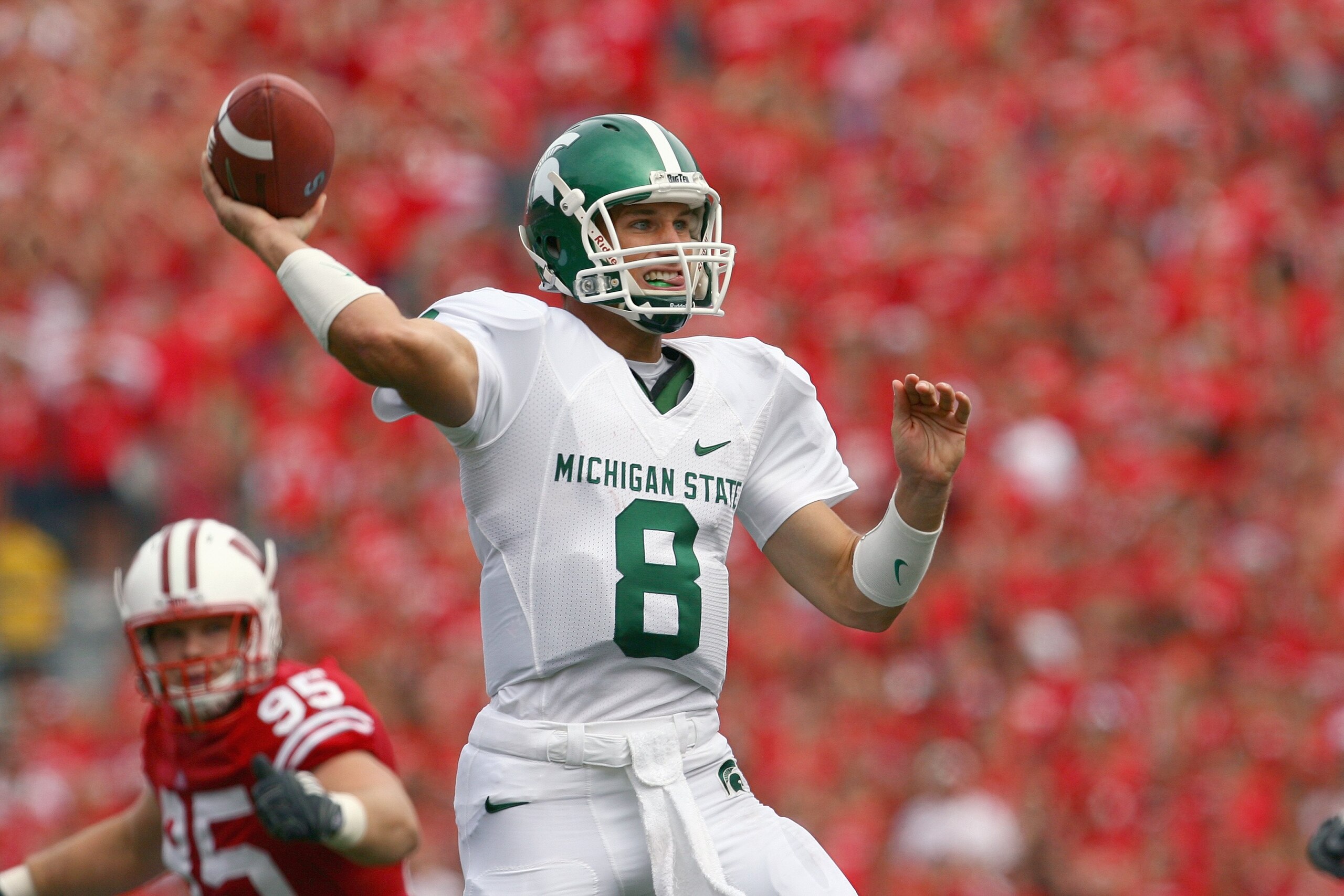 MADISON, WI - SEPTEMBER 26: Kirk Cousins #8 of the Michigan State Spartans looks to pass the ball against the Wisconsin Badgers on September 26, 2009 at Camp Randall Stadium in Madison, Wisconsin. (Photo by Jonathan Daniel/Getty Images)