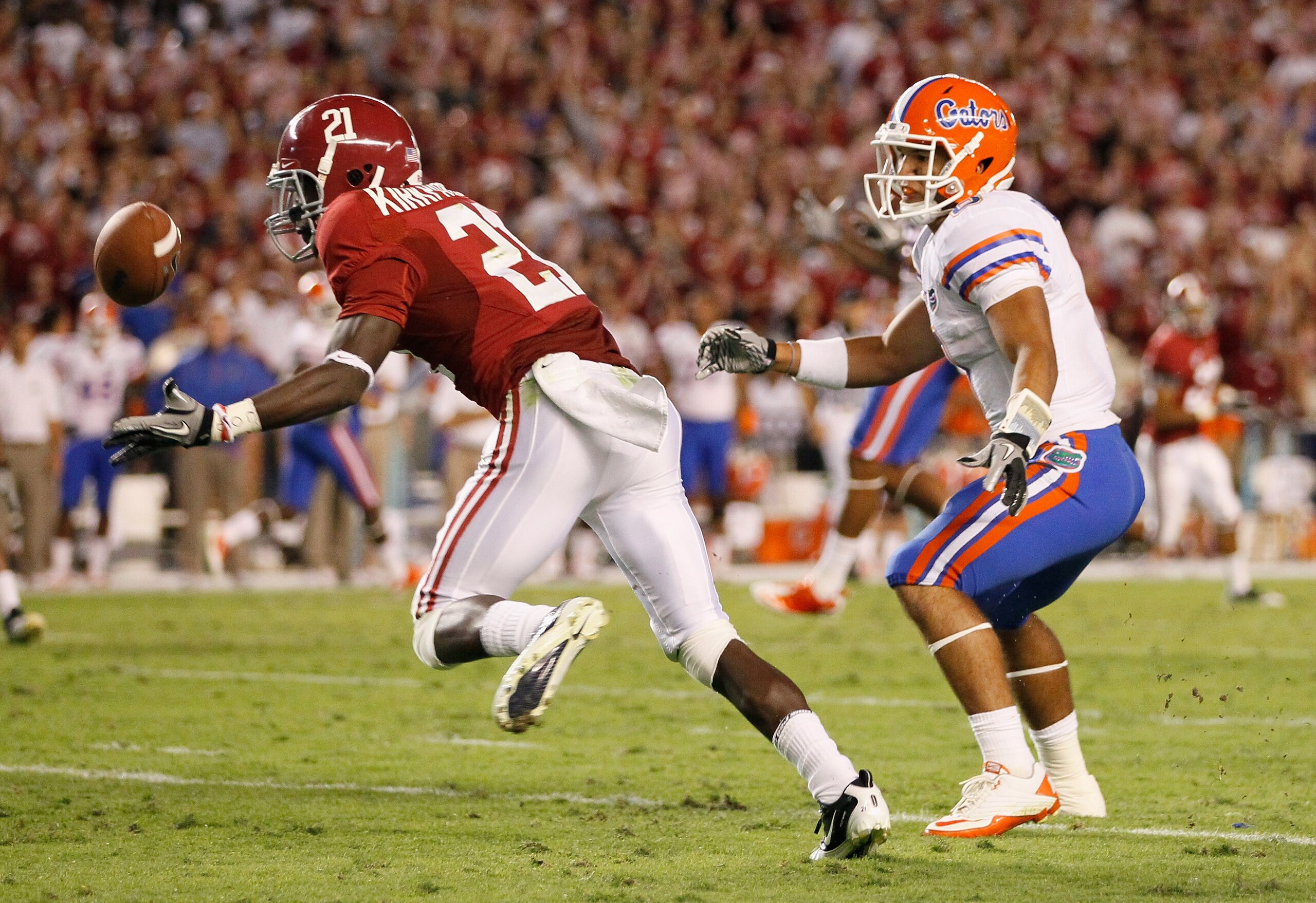 TUSCALOOSA, AL - OCTOBER 02:  Dre Kirkpatrick #21 of the Alabama Crimson Tide intercepts a pass intended for Trey Burton #8 of the Florida Gators at Bryant-Denny Stadium on October 2, 2010 in Tuscaloosa, Alabama.  (Photo by Kevin C. Cox/Getty Images)