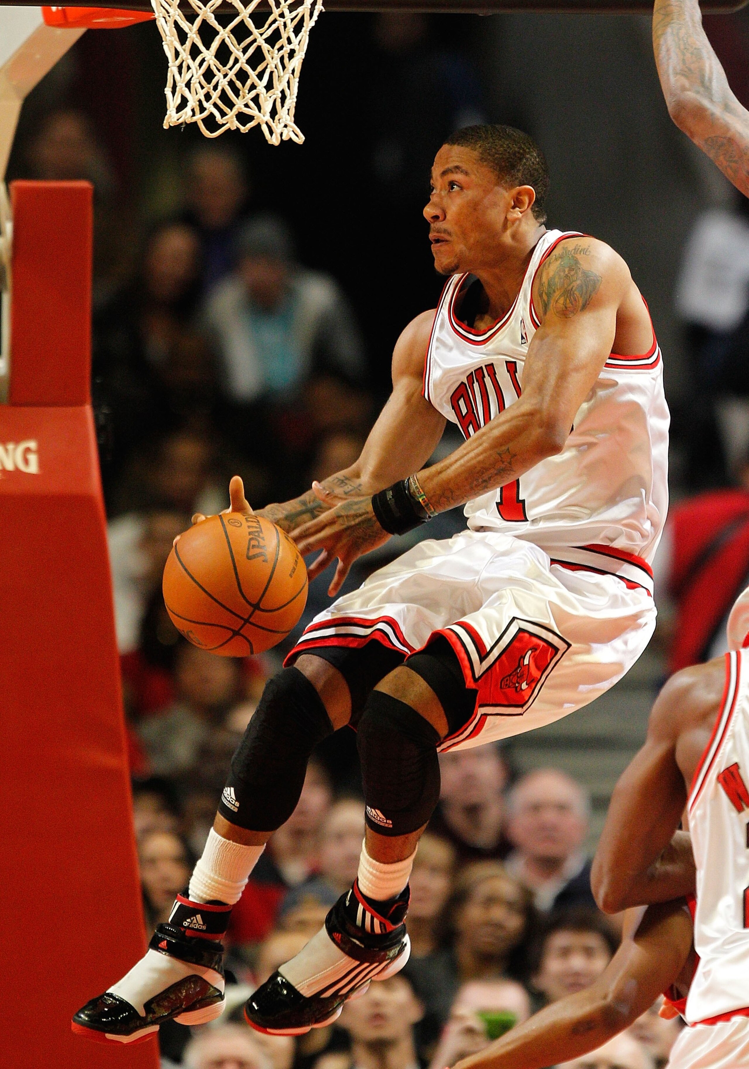 CHICAGO - MARCH 22: Derrick Rose #1 of the Chicago Bulls tries to control the ball against the Houston Rockets at the United Center on March 22, 2010 in Chicago, Illinois. The Bulls defeated the Rockets 98-88. NOTE TO USER: User expressly acknowledges and