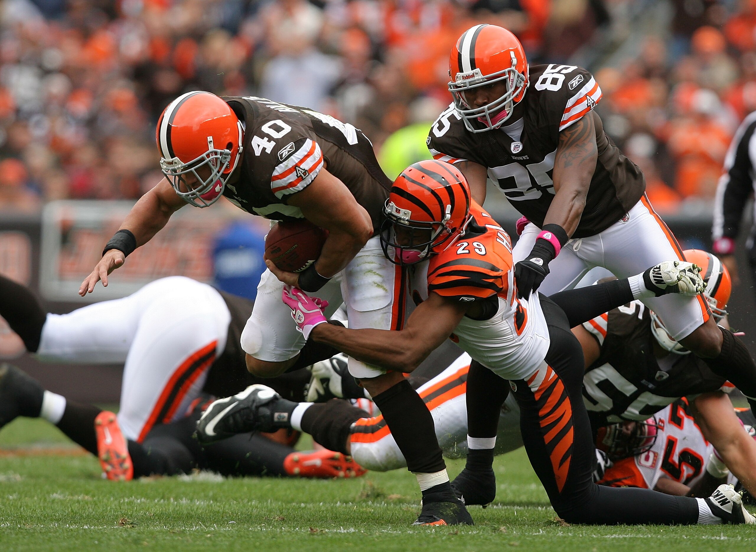 CLEVELAND - OCTOBER 03:  Running back Peyton Hillis #40 of the Cleveland Browns is hit by cornerback Leon Hall #29 of the Cincinnati Bengals at Cleveland Browns Stadium on October 3, 2010 in Cleveland, Ohio.  (Photo by Matt Sullivan/Getty Images)