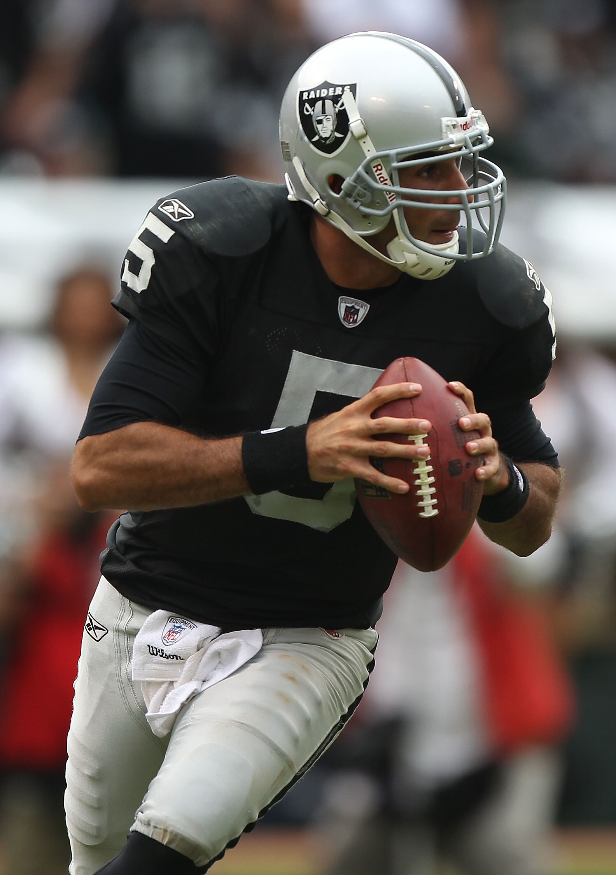 OAKLAND, CA - SEPTEMBER 19:  Bruce Gradkowski #5 of the Oakland Raiders passes against the St. Louis Rams during an NFL game at Oakland-Alameda County Coliseum on September 19, 2010 in Oakland, California.  (Photo by Jed Jacobsohn/Getty Images)