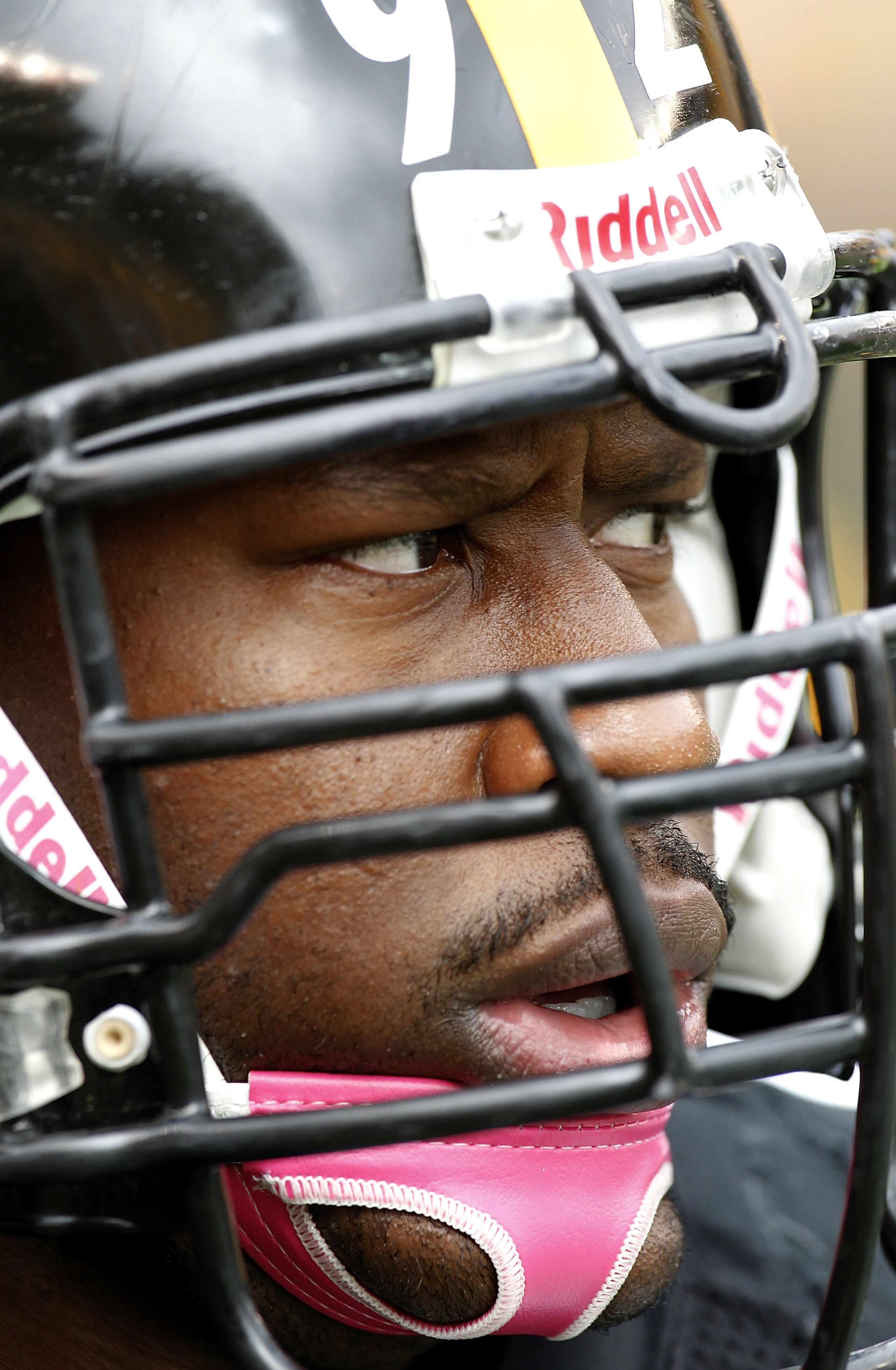 PITTSBURGH - OCTOBER 03:  James Harrison #92 of the Pittsburgh Steelers wears a pink chin strap for breast cancer awareness prior to playing the Baltimore Ravens on October 3, 2010 at Heinz Field in Pittsburgh, Pennsylvania.  (Photo by Gregory Shamus/Gett