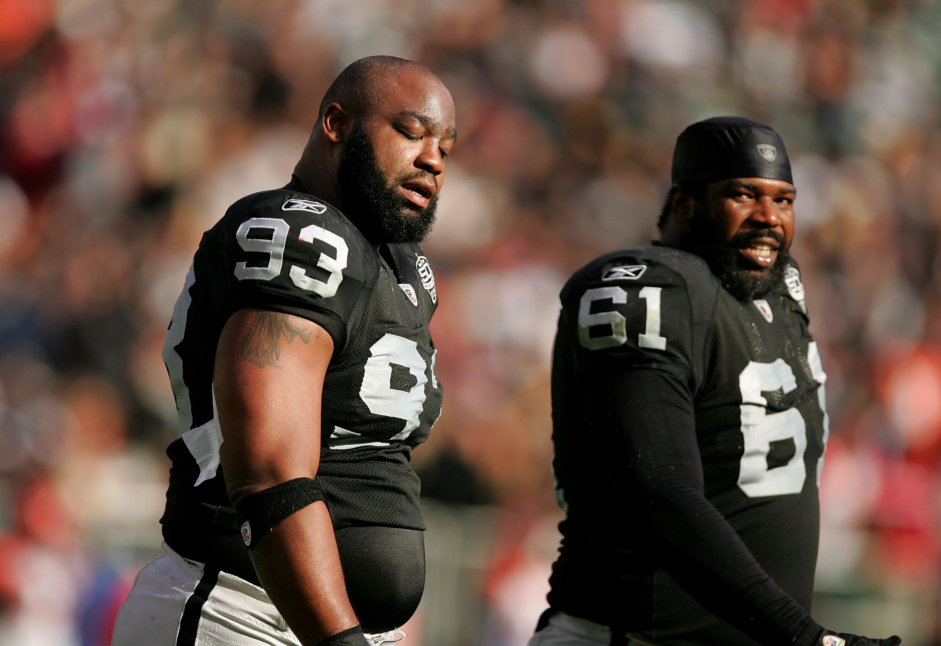 OAKLAND, CA - NOVEMBER 22:  Tommy Kelly #93 and Gerard Warren #61 of the Oakland Raiders react after the Cincinnati Bengals scored a touchdown at Oakland-Alameda County Coliseum on November 22, 2009 in Oakland, California.  (Photo by Ezra Shaw/Getty Image