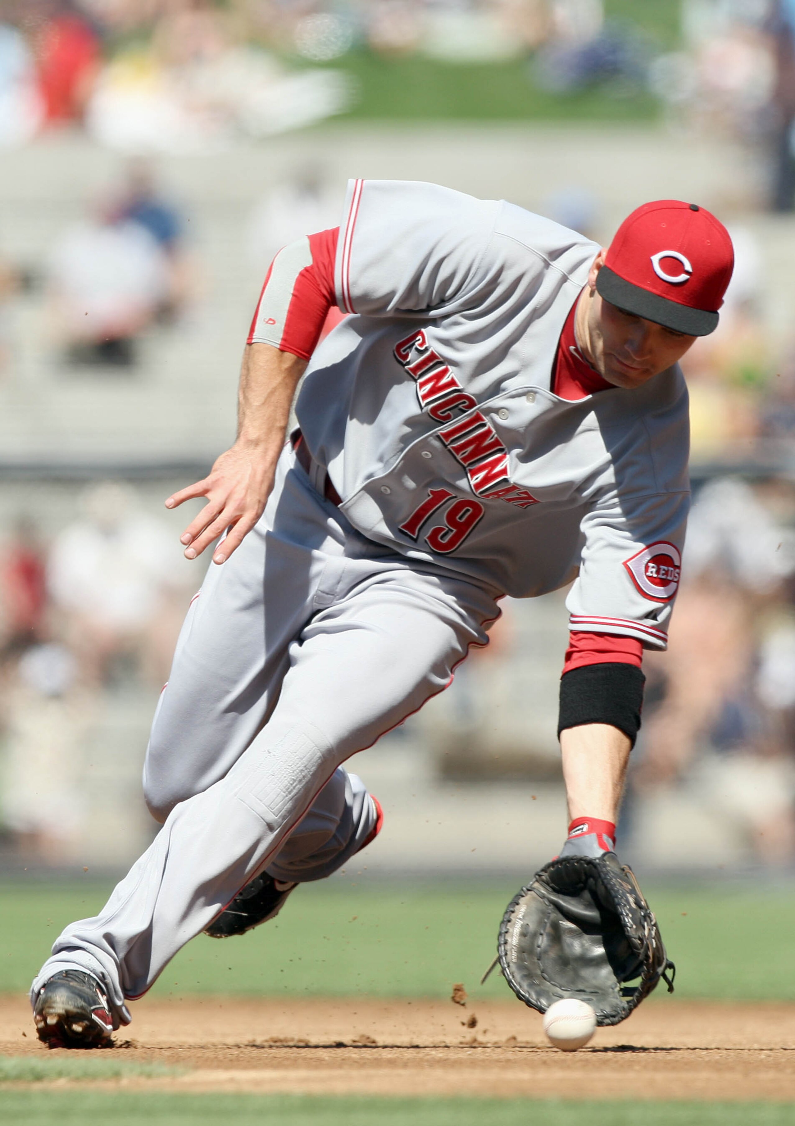 SAN DIEGO, CA - SEPTEMBER 26:  First Baseman Joey Votto #19 of Cincinnati Reds makes a play on a ground ball for an out against the San Diego Padres during their MLB game on September 26, 2010 at PETCO Park in San Diego, California. (Photo by Donald Miral