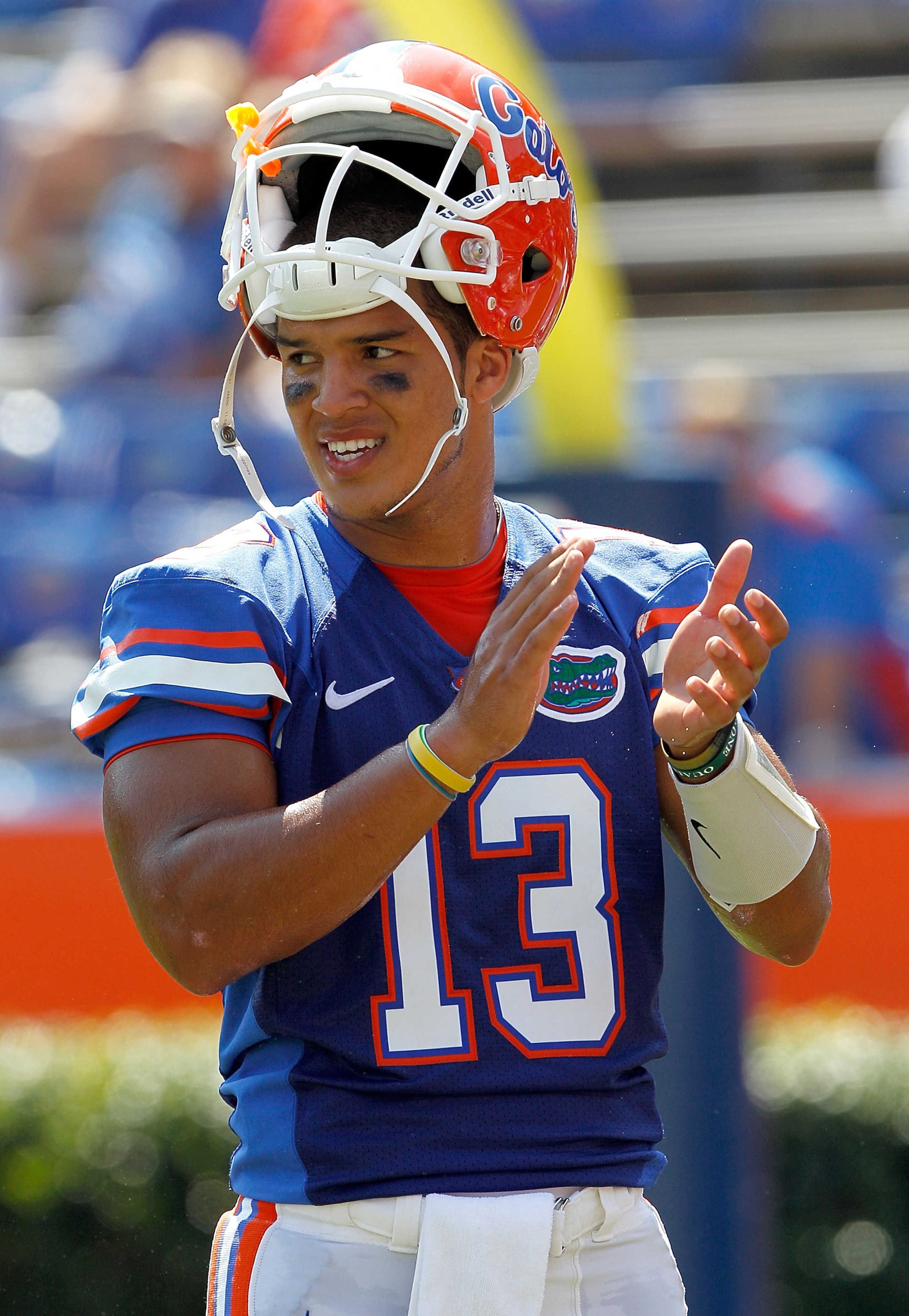 GAINESVILLE, FL - SEPTEMBER 11:  Quarterback Trey Burton #13 of the Florida Gators claps prior to a game against the South Florida Bulls at Ben Hill Griffin Stadium on September 11, 2010 in Gainesville, Florida.  (Photo by Sam Greenwood/Getty Images)
