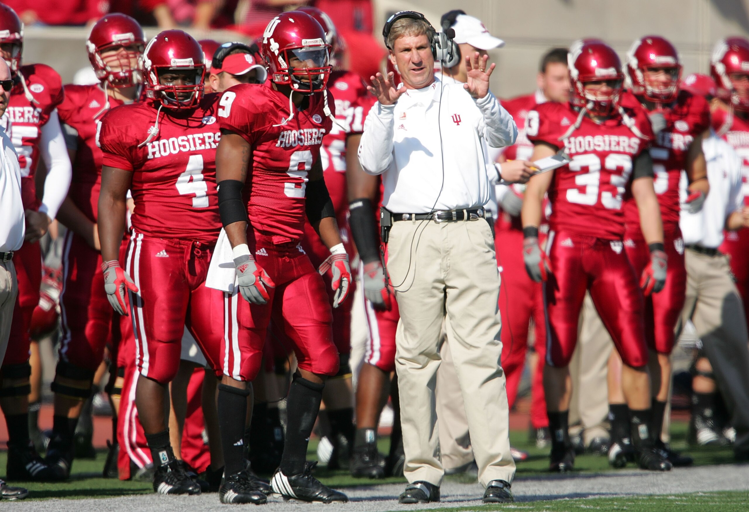 BLOOMINGTON, IN - NOVEMBER 3: Bill Lynch, the Head Coach of the Indiana Hoosiers, gives instructions to Tracy Porter #9 during the game against the Ball State Cardinals at Memorial Stadium November 3, 2007 in Bloomington, Indiana.  (Photo by Andy Lyons/Ge