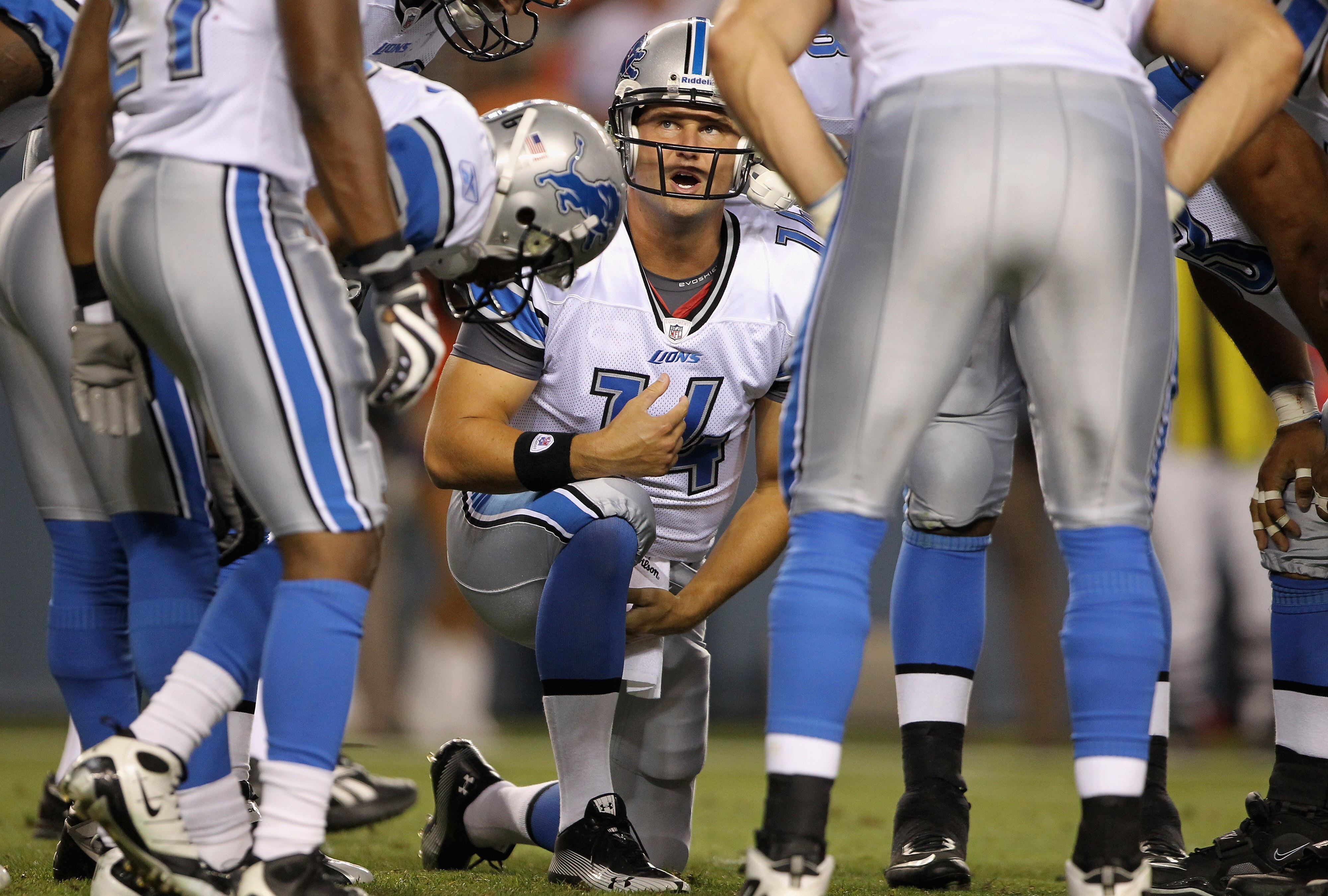 DENVER - AUGUST 21:  Quarterback Shaun Hill #14 of the Detroit Lions runs the huddle against the Denver Broncos during preseason NFL action at INVESCO Field at Mile High on August 21, 2010 in Denver, Colorado. The Lions defeated the Broncos 25-20.  (Photo