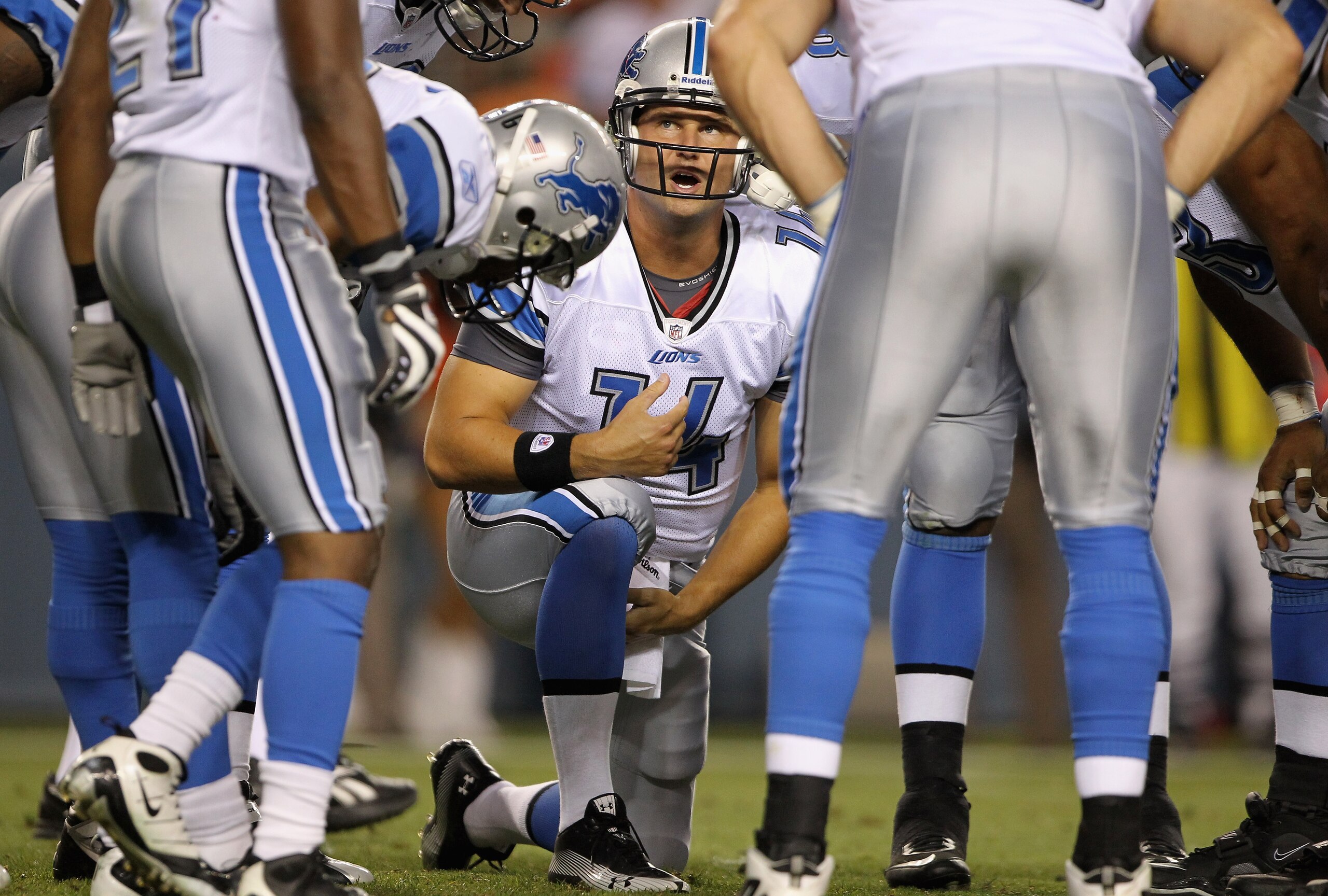 DENVER - AUGUST 21:  Quarterback Shaun Hill #14 of the Detroit Lions runs the huddle against the Denver Broncos during preseason NFL action at INVESCO Field at Mile High on August 21, 2010 in Denver, Colorado. The Lions defeated the Broncos 25-20.  (Photo