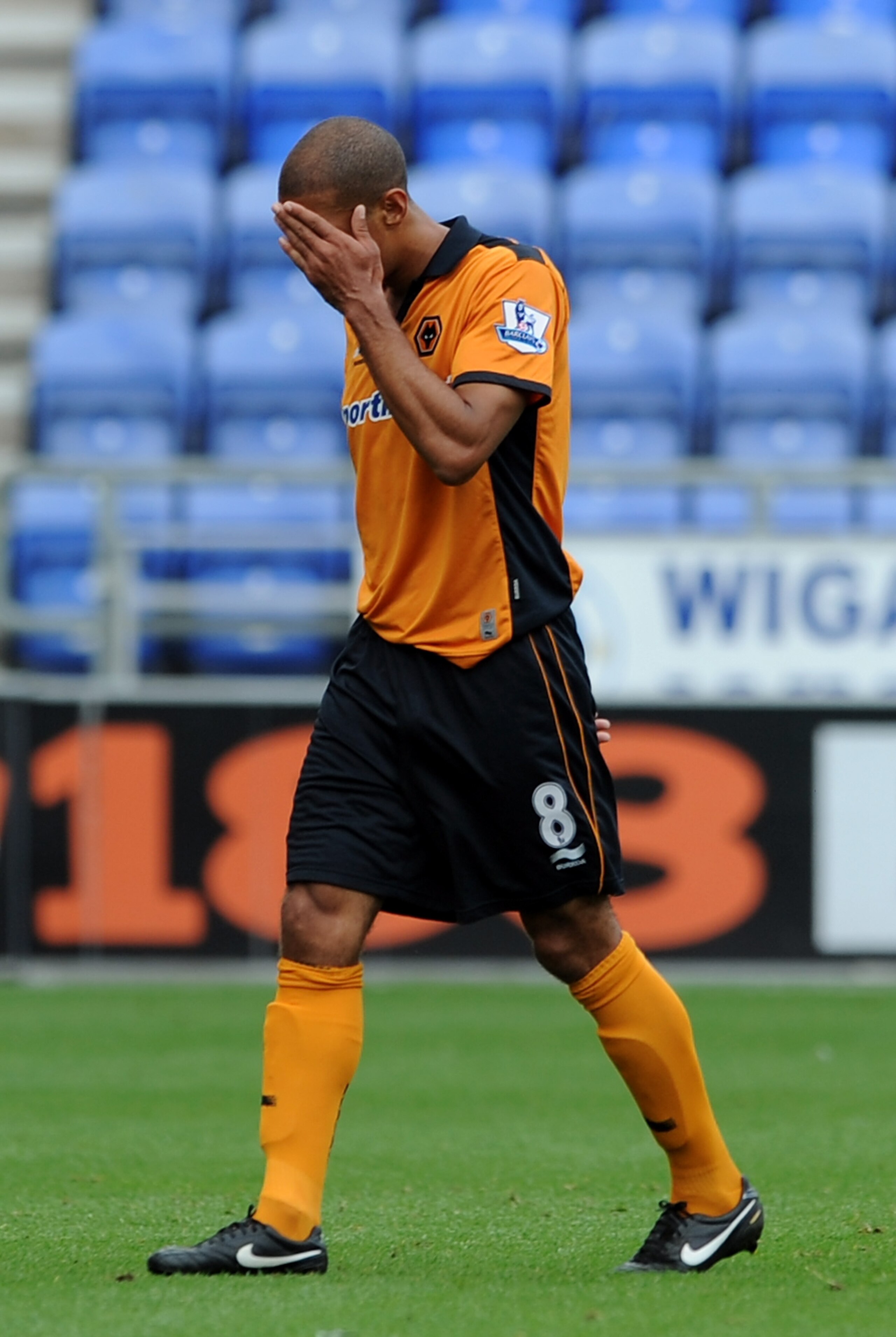 WIGAN, ENGLAND - OCTOBER 02:  Karl Henry of Wolverhampton Wanderers looks dejected as he leaves the field after being sent-off during the Barclays Premier League match between Wigan Athletic and Wolverhampton Wanderers at DW Stadium on October 2, 2010 in 