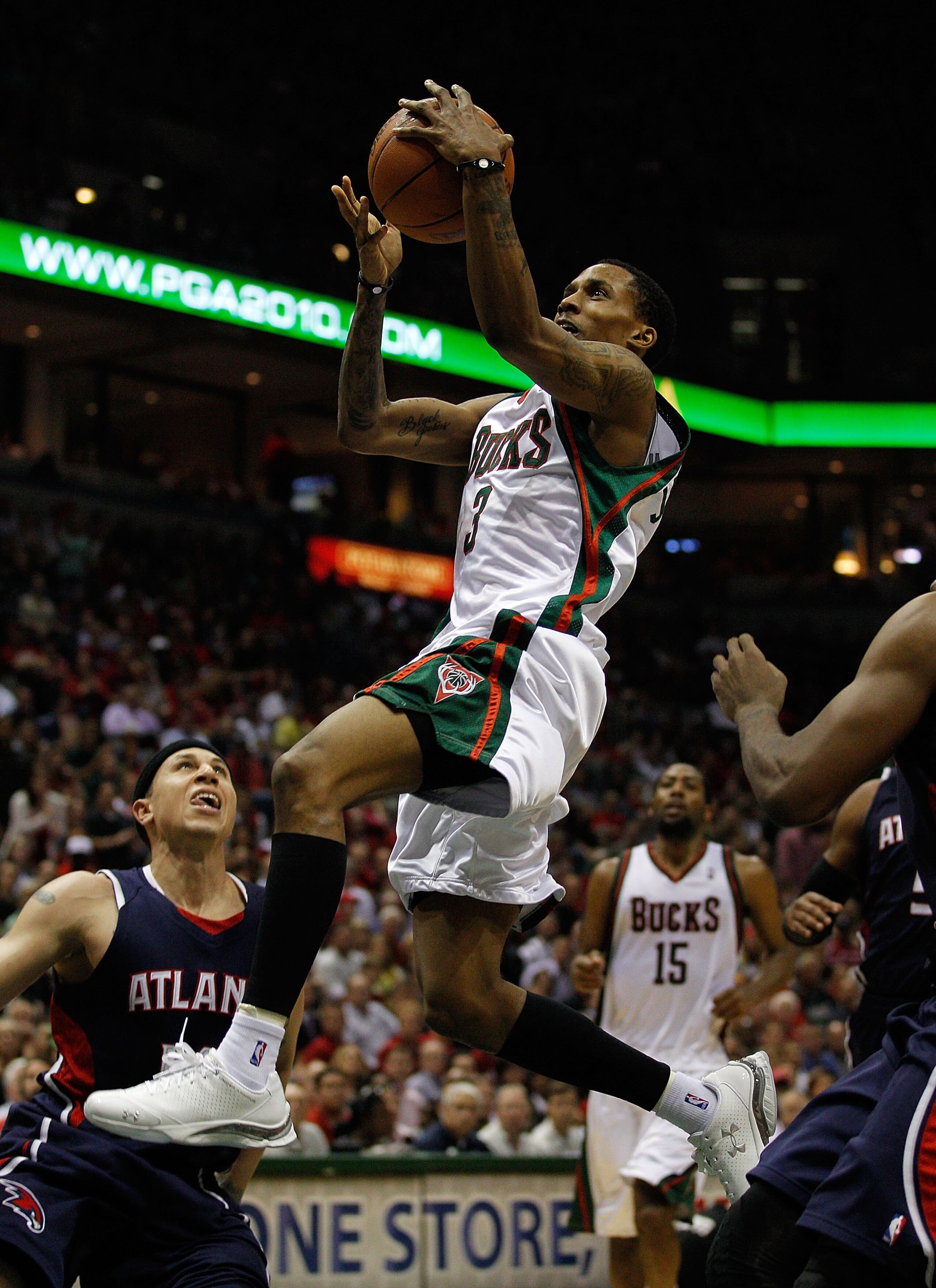 MILWAUKEE - APRIL 30: Brandon Jennings #3 of the Milwaukee Bucks drives to the basket over Mike Bibby #10 of the Atlanta Hawks in Game Six of the Eastern Conference Quarterfinals during the 2010 NBA Playoffs at the Bradley Center on April 30, 2010 in Milw