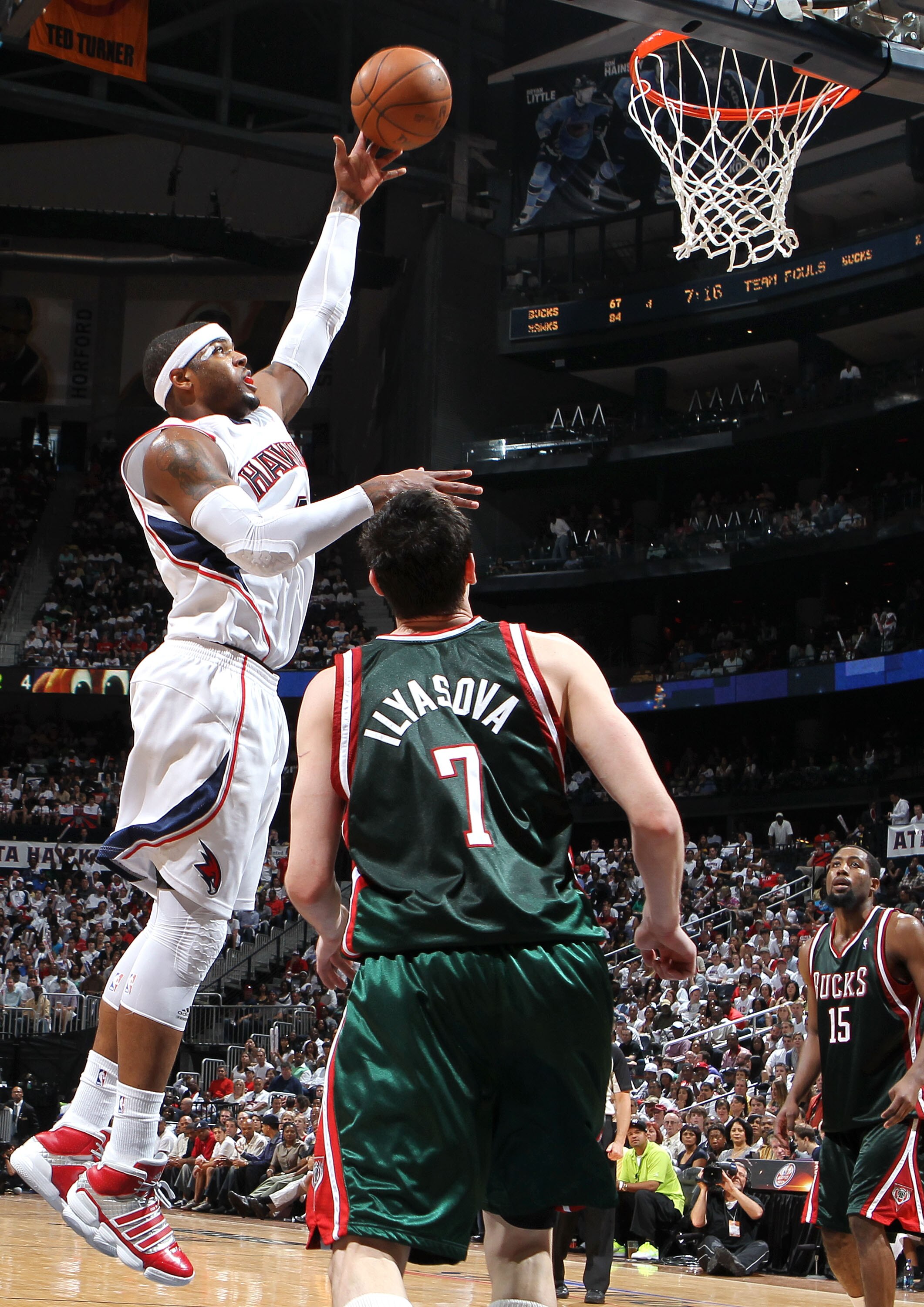ATLANTA - MAY 2:  Forward Josh Smith #5 of the Atlanta Hawks shoots over forward Ersan Ilyasova #7 of the Milwaukee Bucks while guard John Salmons #14 (R) looks on during Game Seven of the Eastern Conference Quarterfinals during the 2010 NBA Playoffs at P